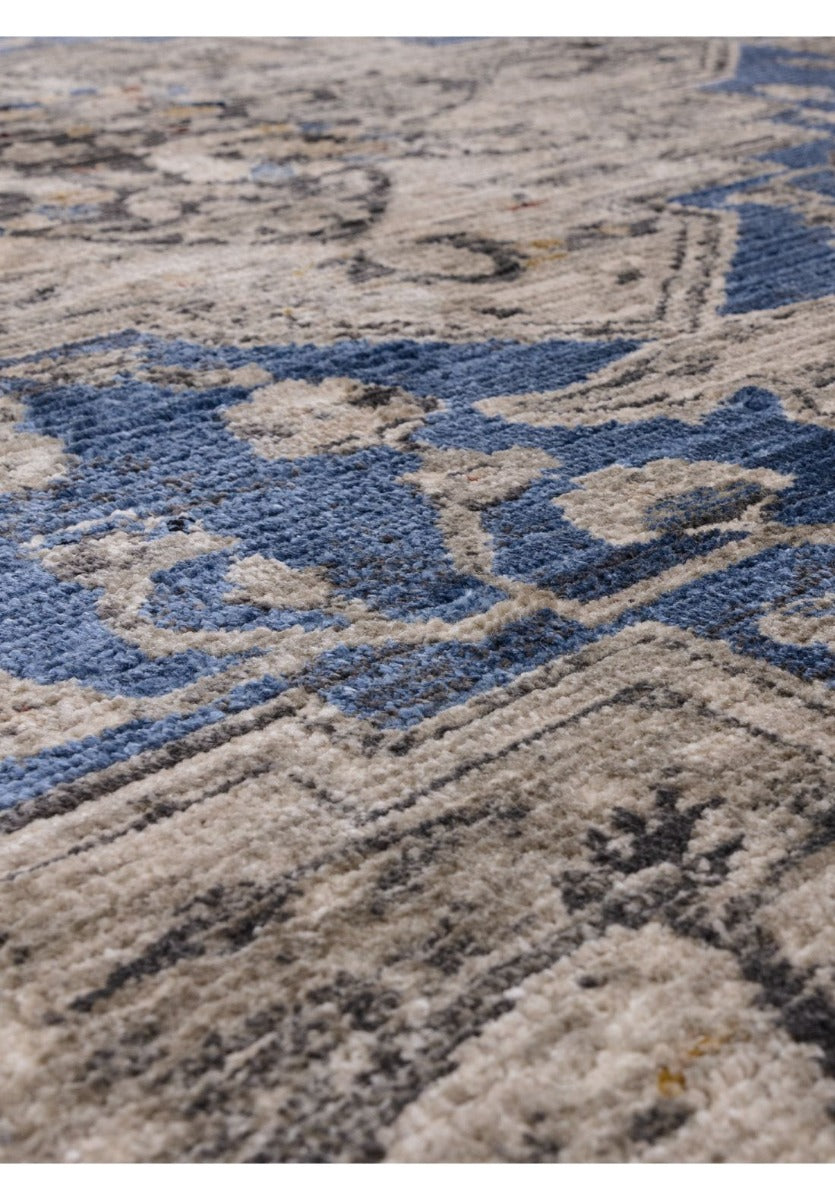 Vintage style distressed rug in shades of blue and beige
