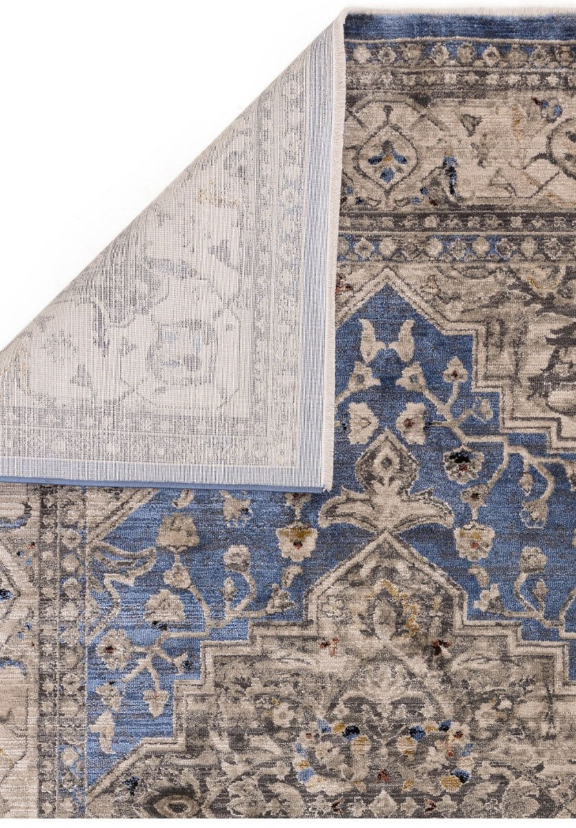 Vintage style distressed rug in shades of blue and beige