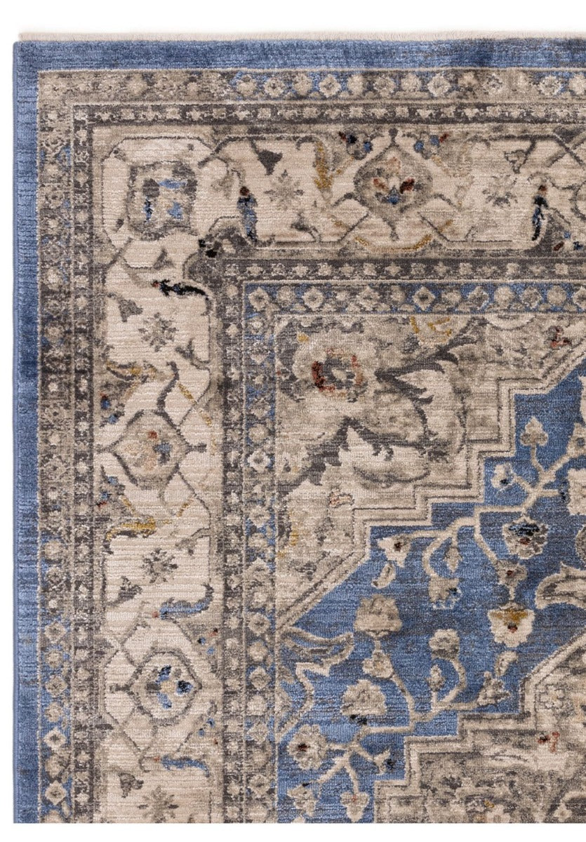 Vintage style distressed rug in shades of blue and beige