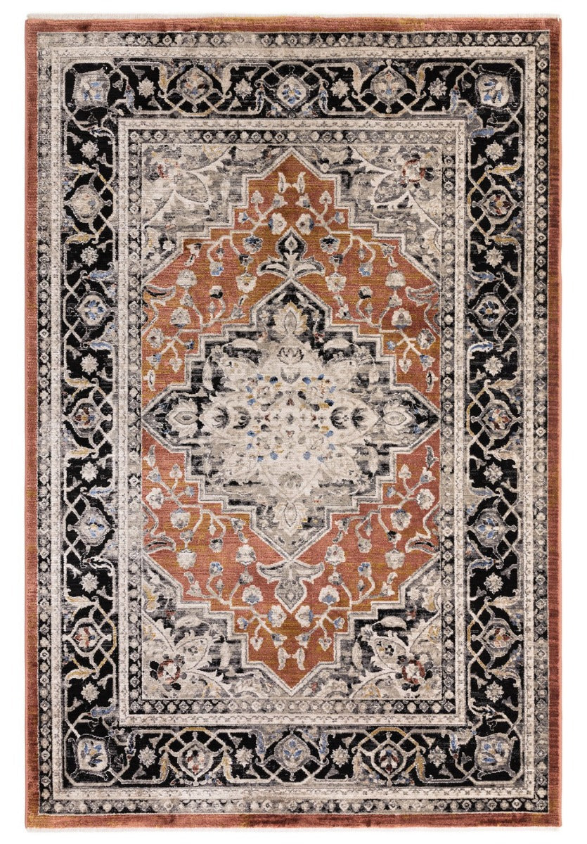 Vintage style distressed rug in shades of black, beige and terracotta