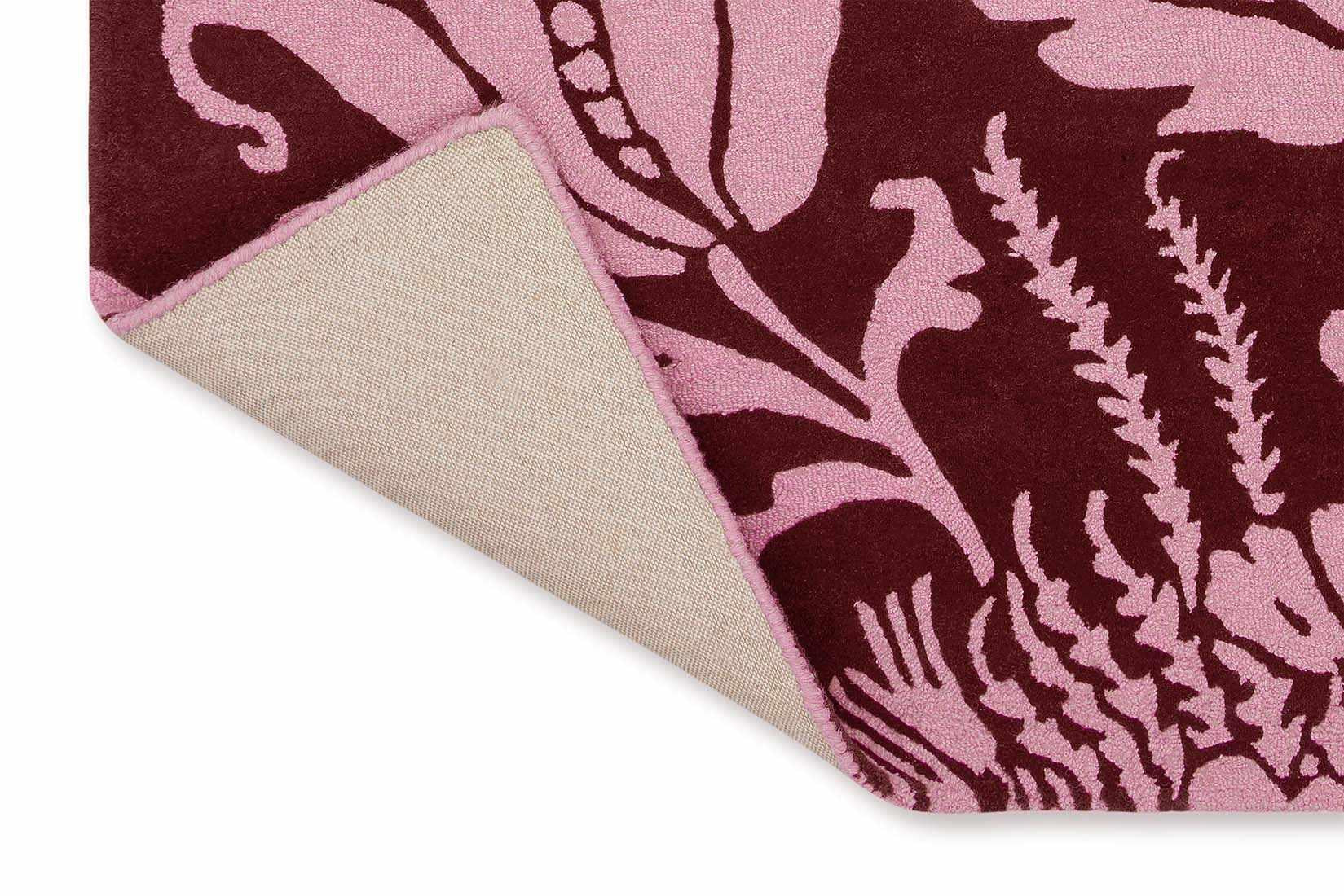 red wool rug with pink flowers