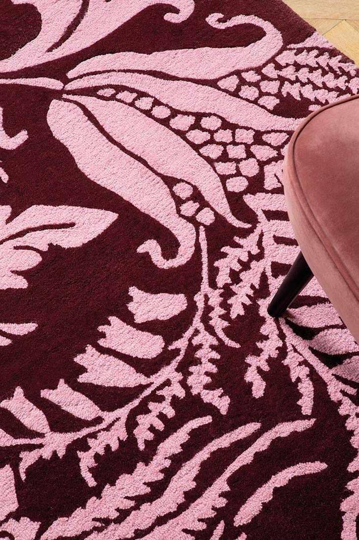 red wool rug with pink flowers