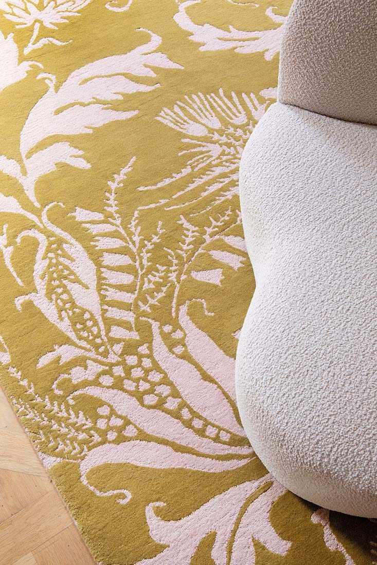 yellow wool rug with pink flowers