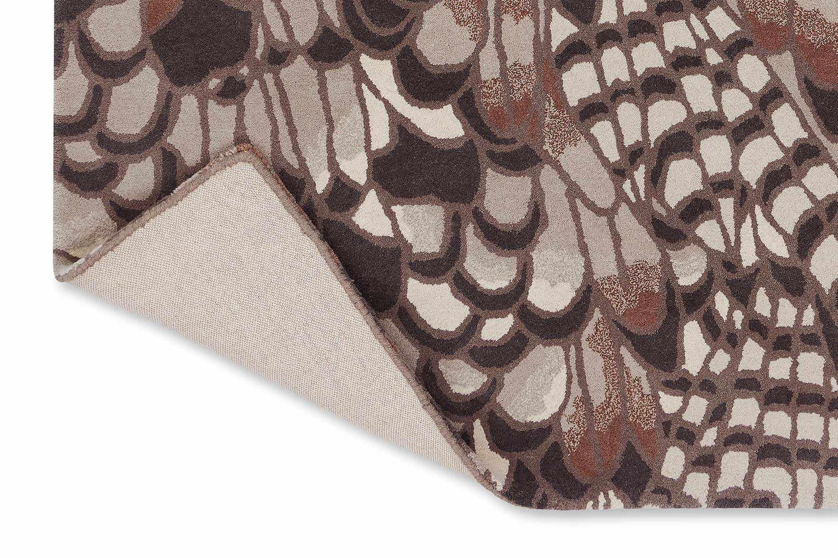 brown wool rug with feather pattern