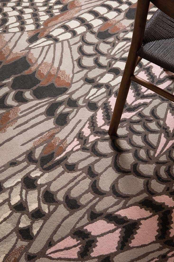 brown wool rug with feather pattern