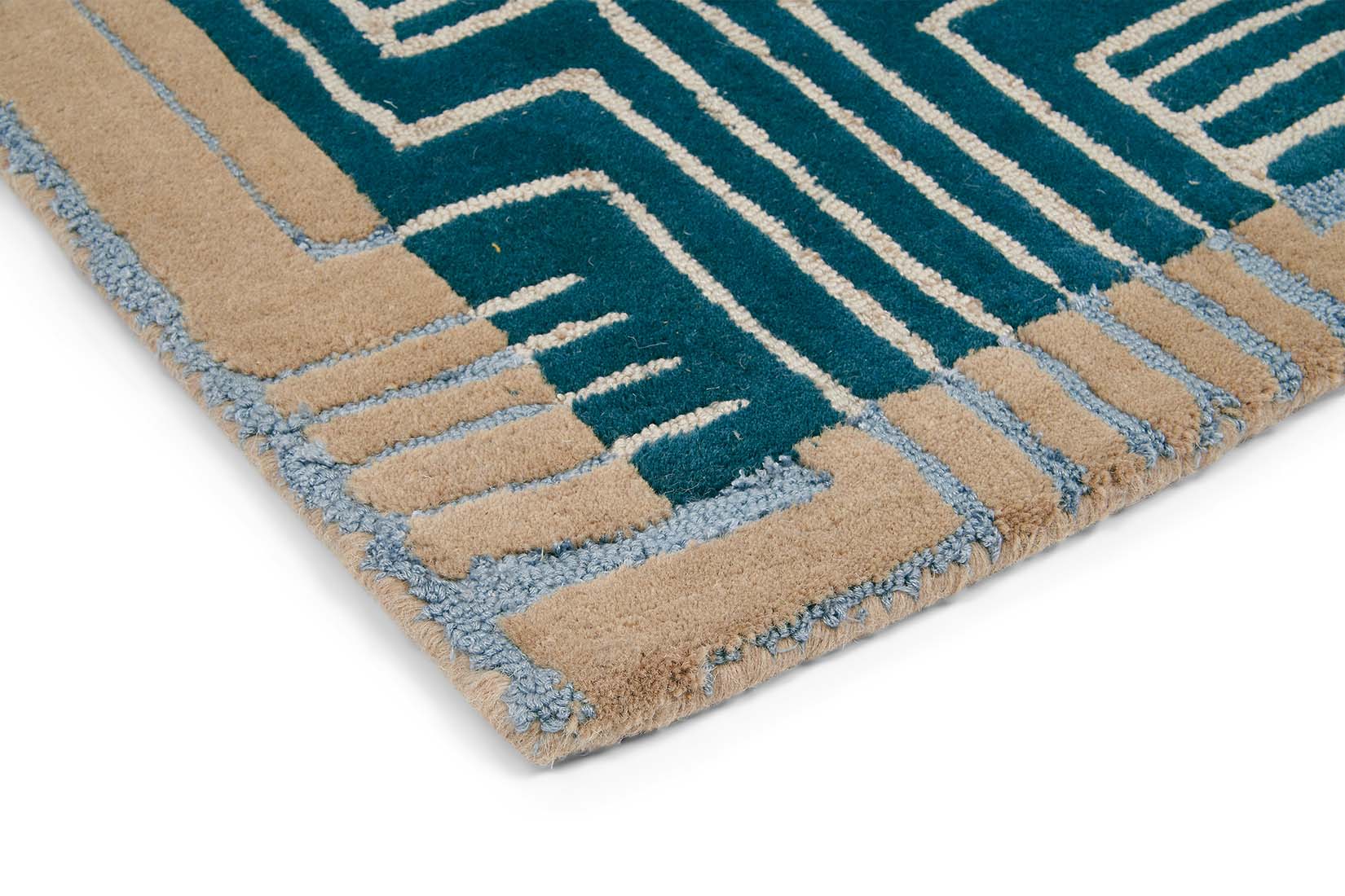 Rectangular green rug with beige border and grey art deco pattern