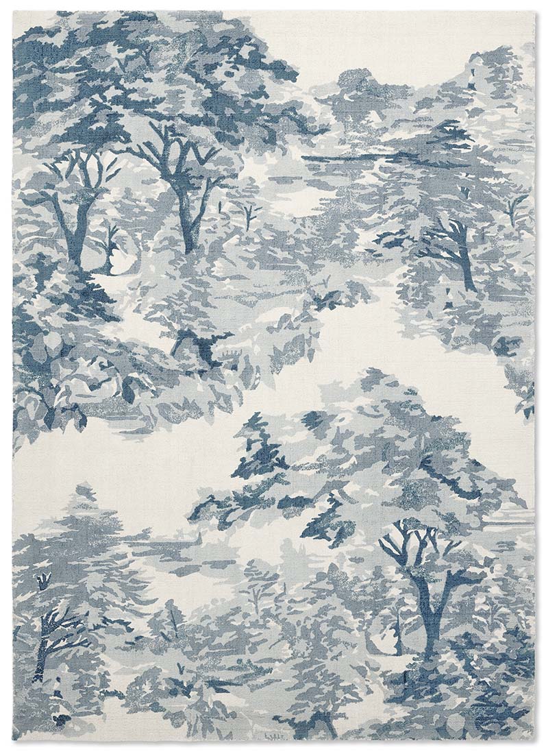 cream cotton rug with tree pattern in blue
