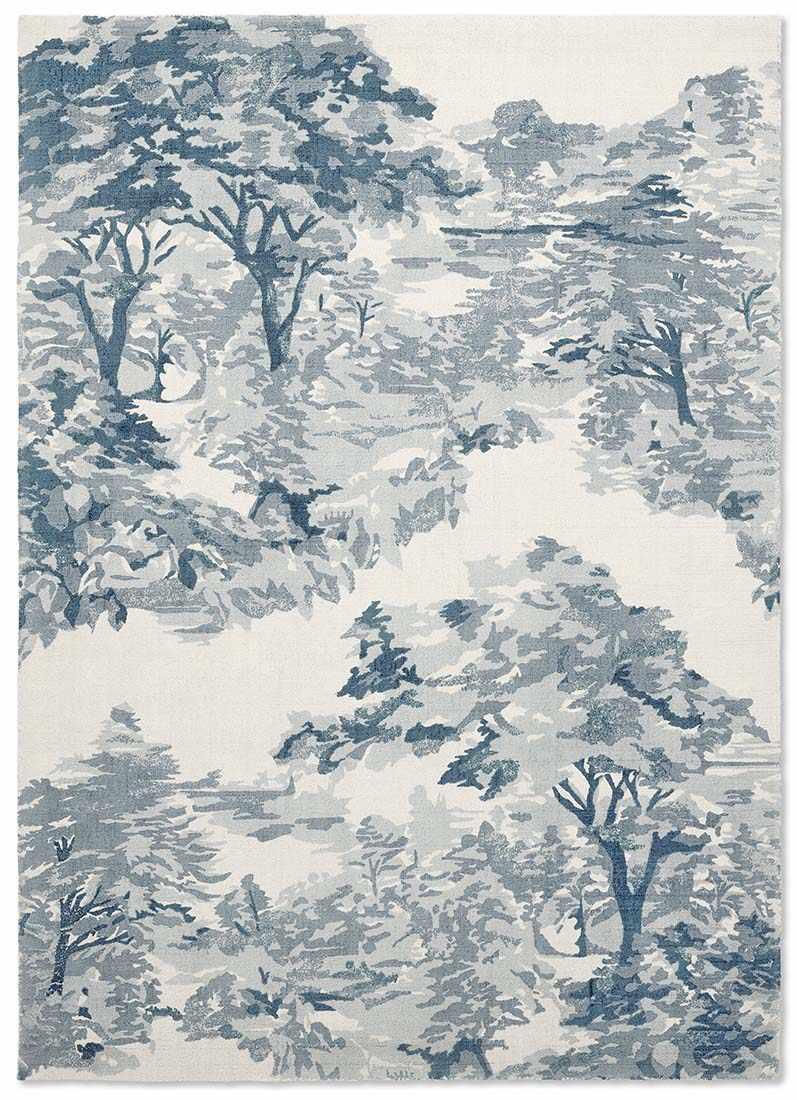 cream cotton rug with tree pattern in blue