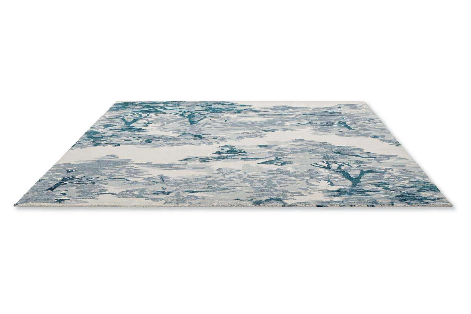 cream cotton rug with tree pattern in blue