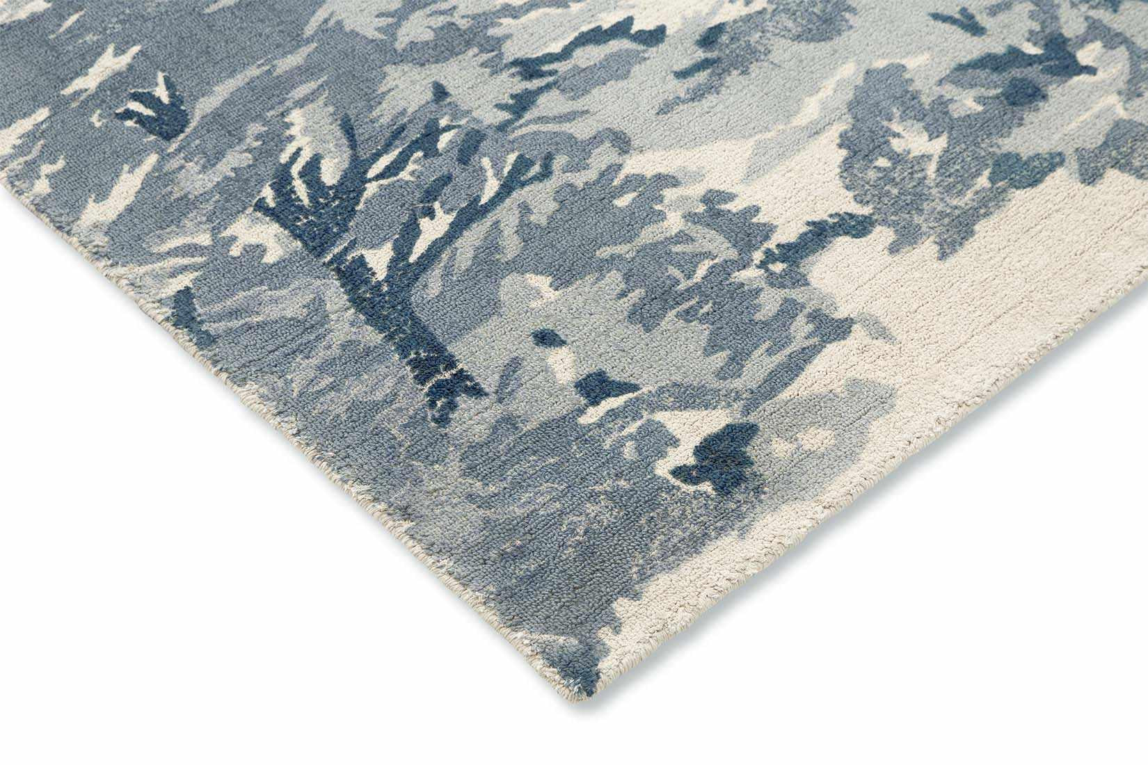 cream cotton rug with tree pattern in blue