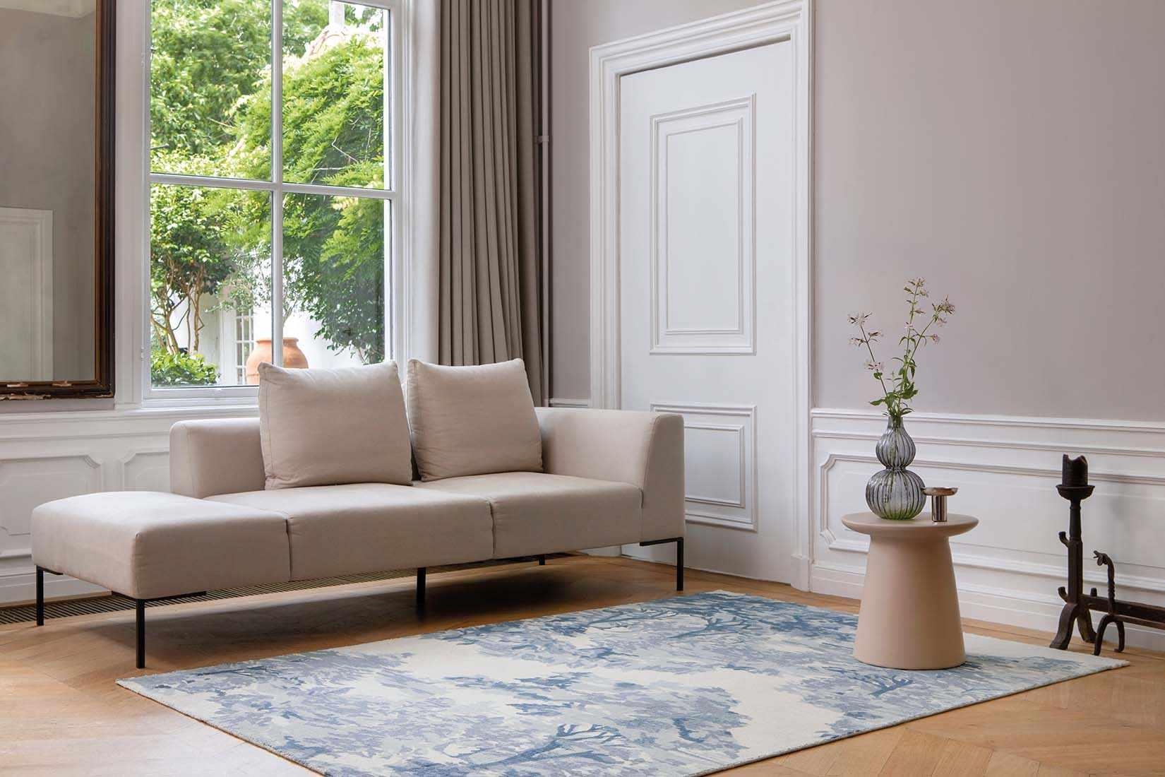 cream cotton rug with tree pattern in blue