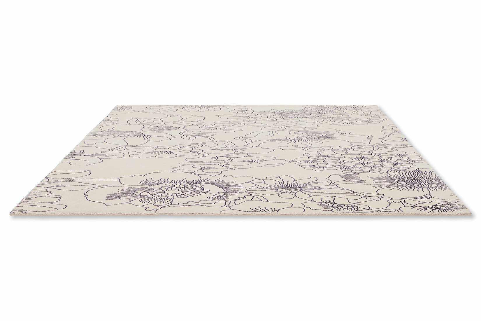 cream cotton rug with floral pattern in blue