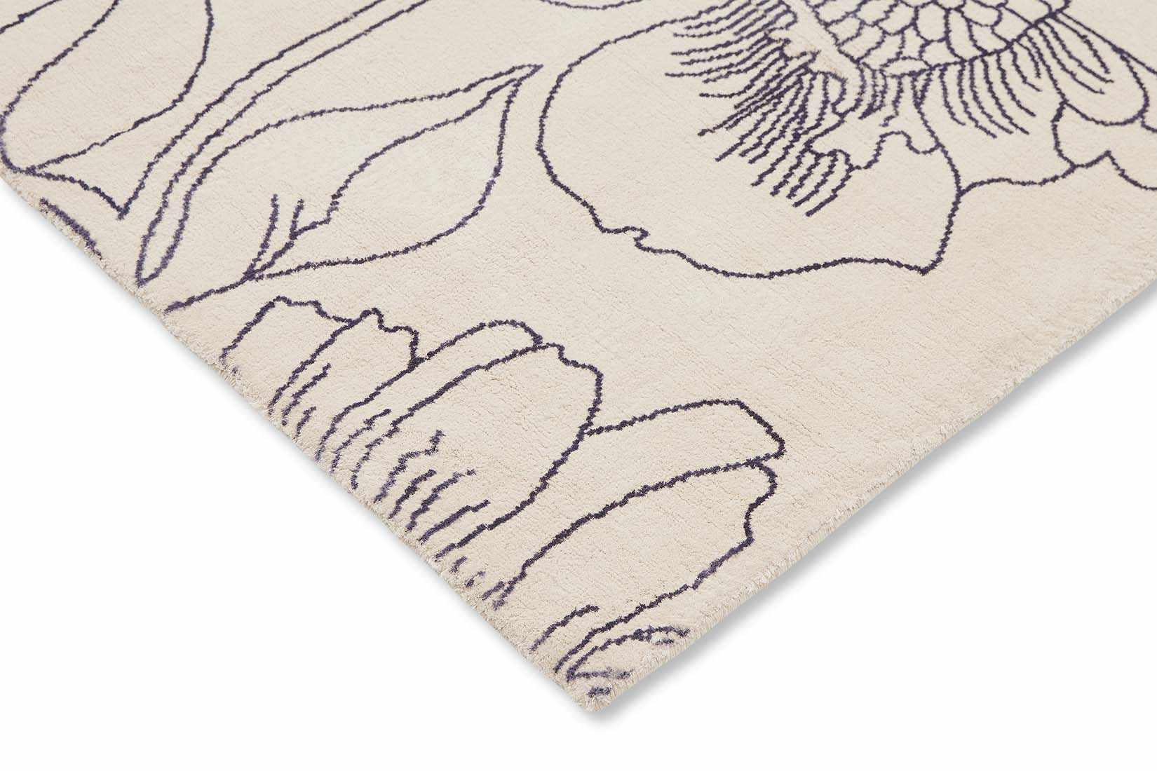 cream cotton rug with floral pattern in blue