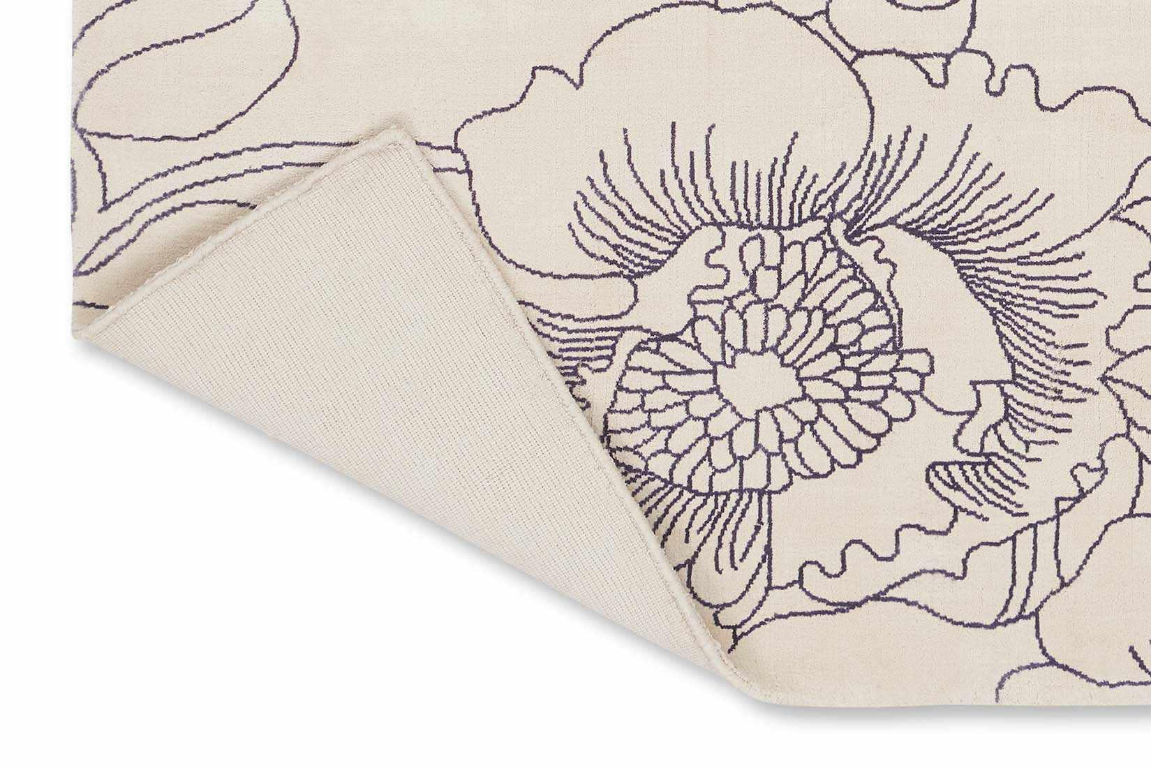 cream cotton rug with floral pattern in blue