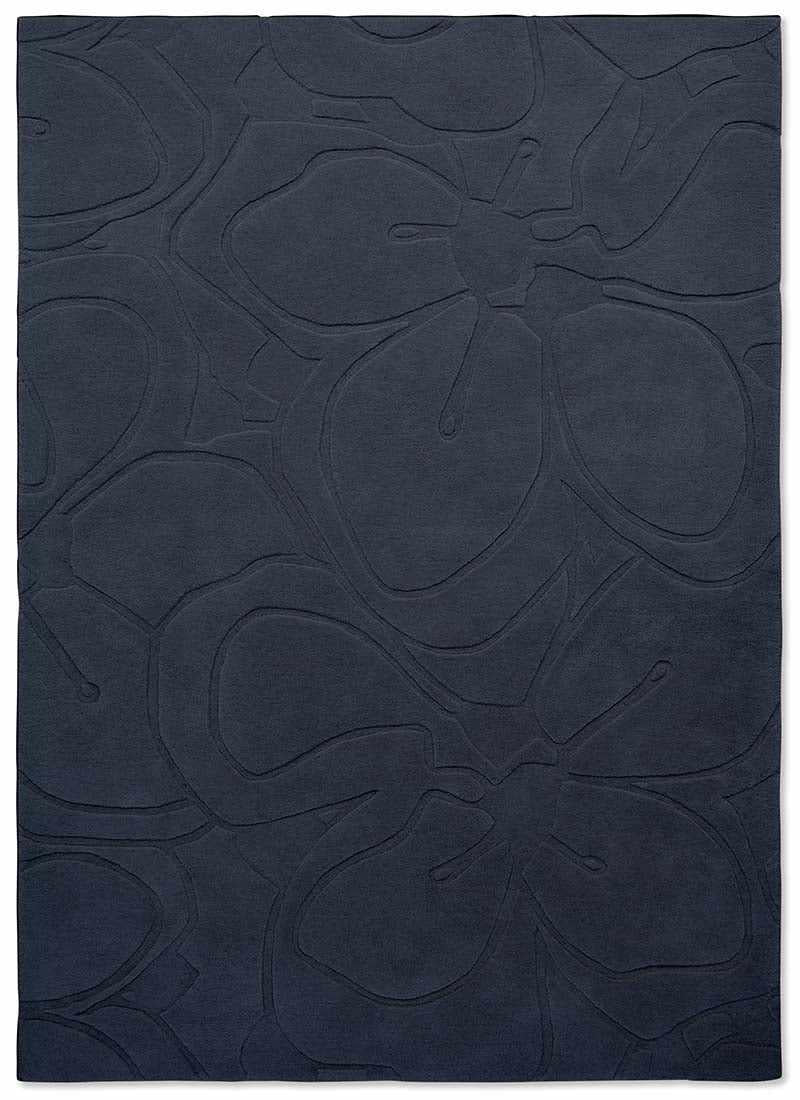 blue wool rug with floral shapes
