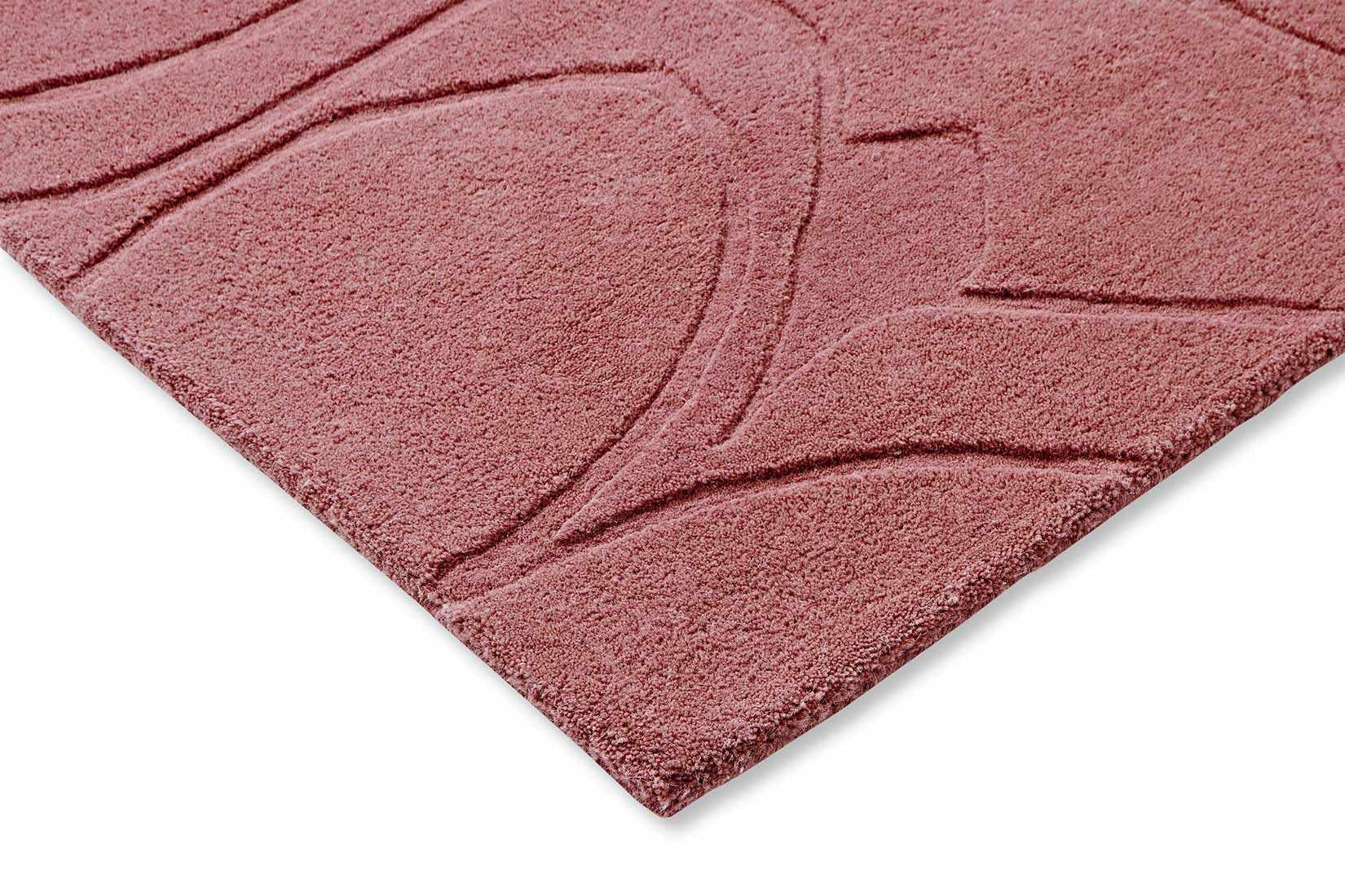 pink wool rug with floral shapes
