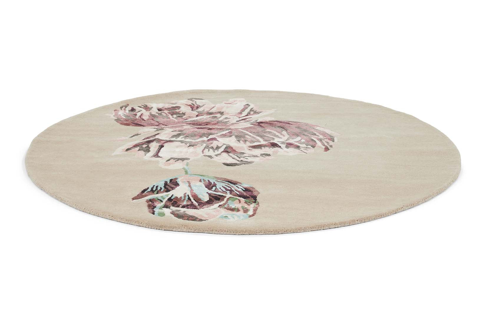 Round beige rug with large white and purple flower motif