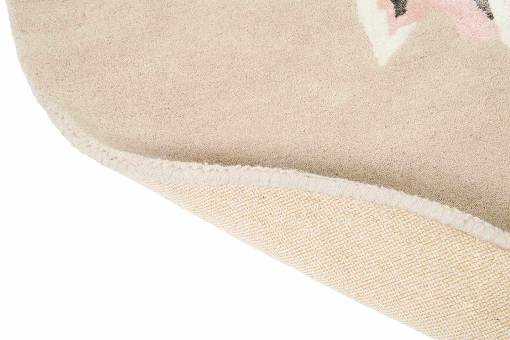 Round beige rug with large white and purple flower motif