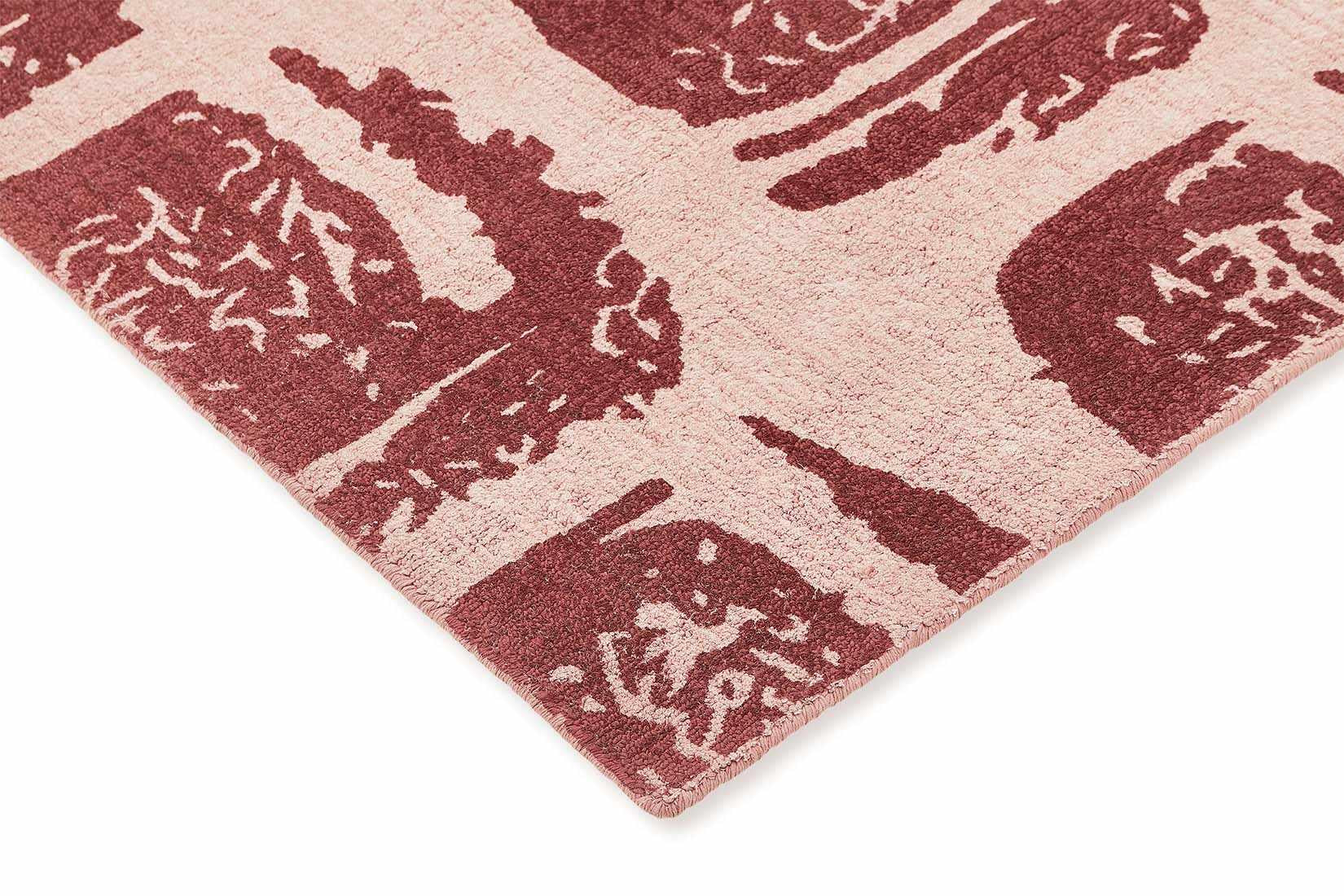 pink cotton rug with abstract red squares