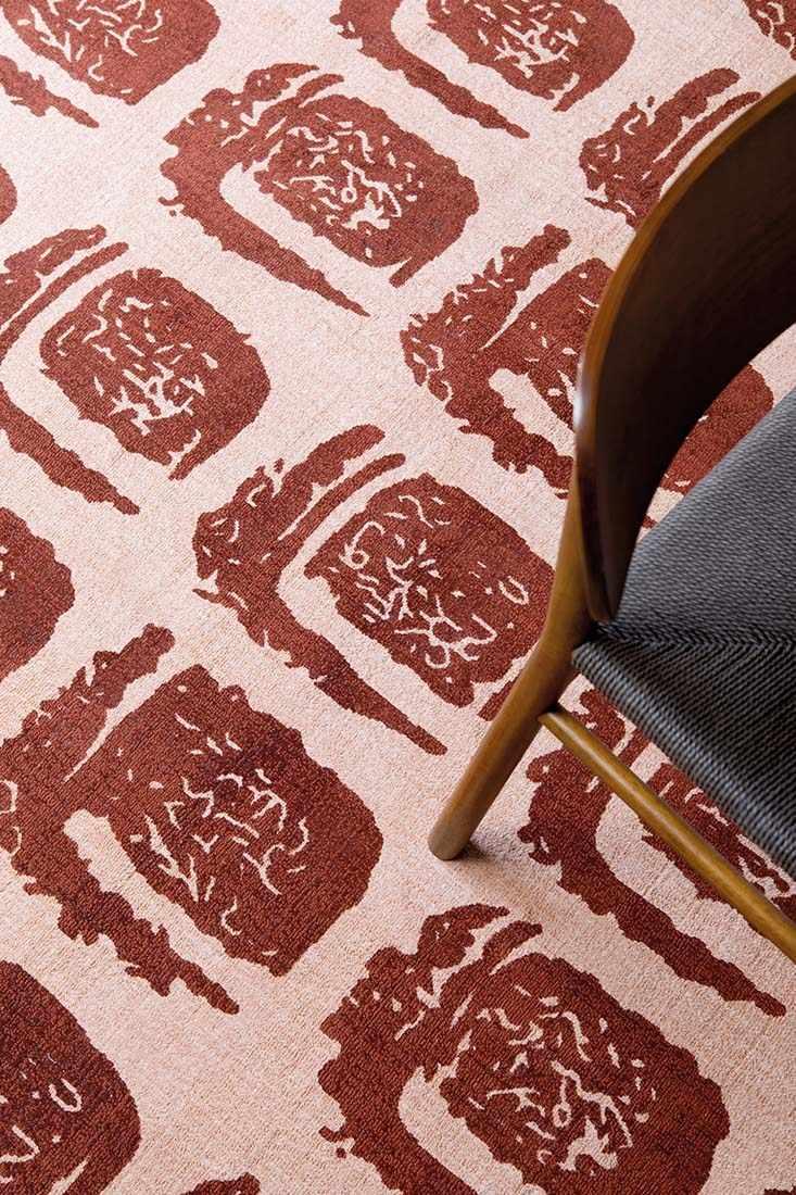 pink cotton rug with abstract red squares
