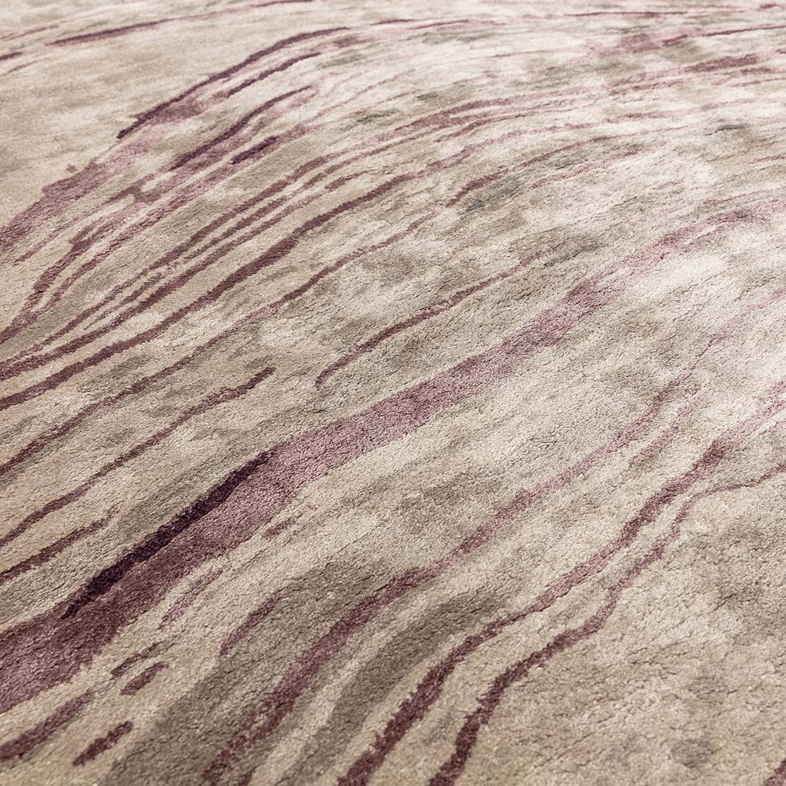shiny purple and beige handtufted abstract rug in a marble design