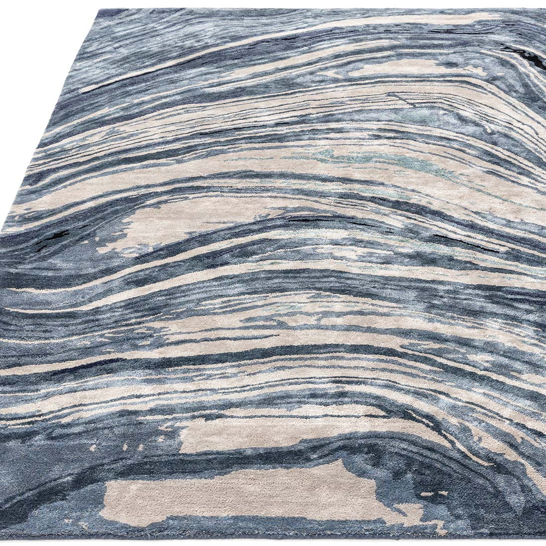 shiny blue and beige handtufted abstract rug in a marble design