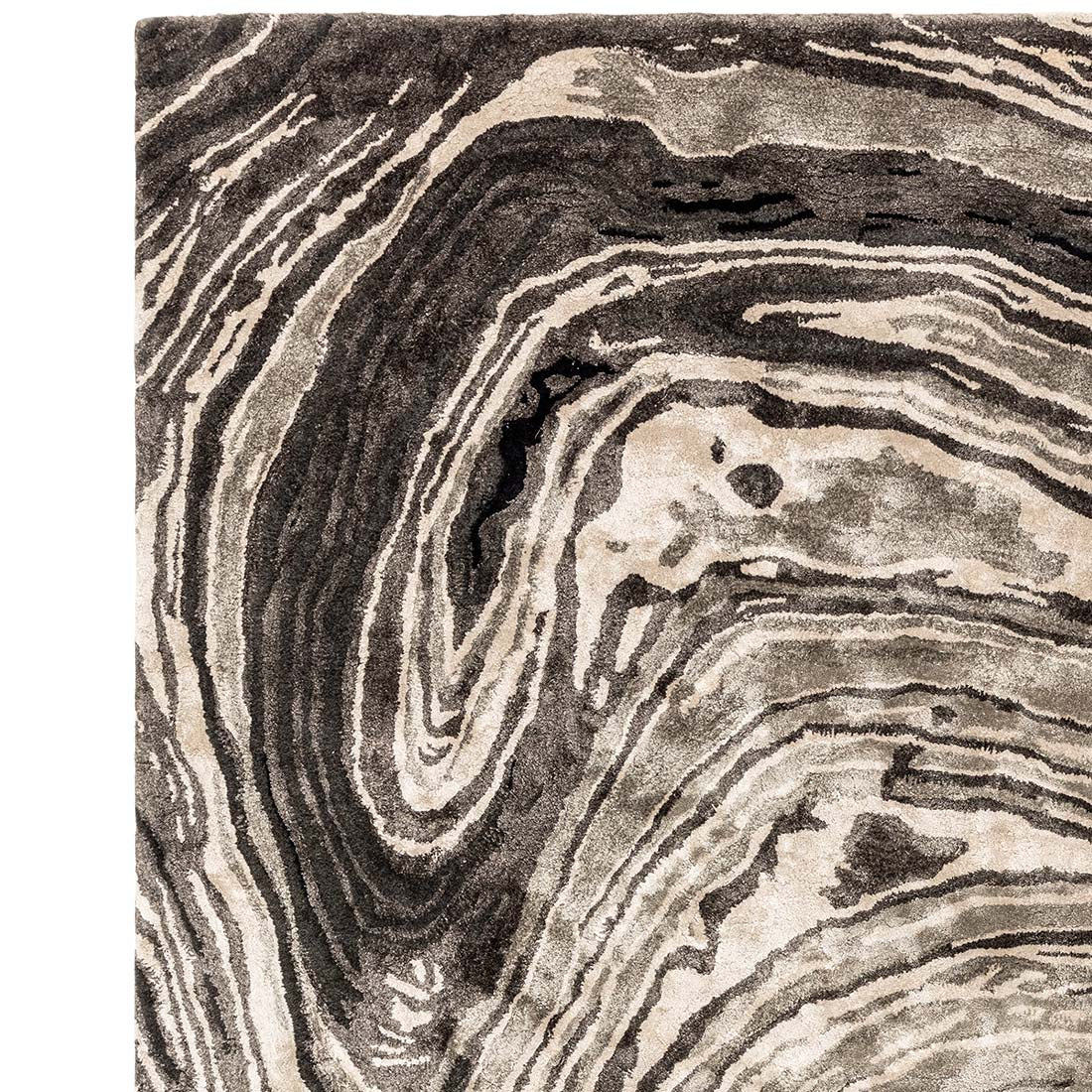 black and beige handtufted abstract rug in a marble design