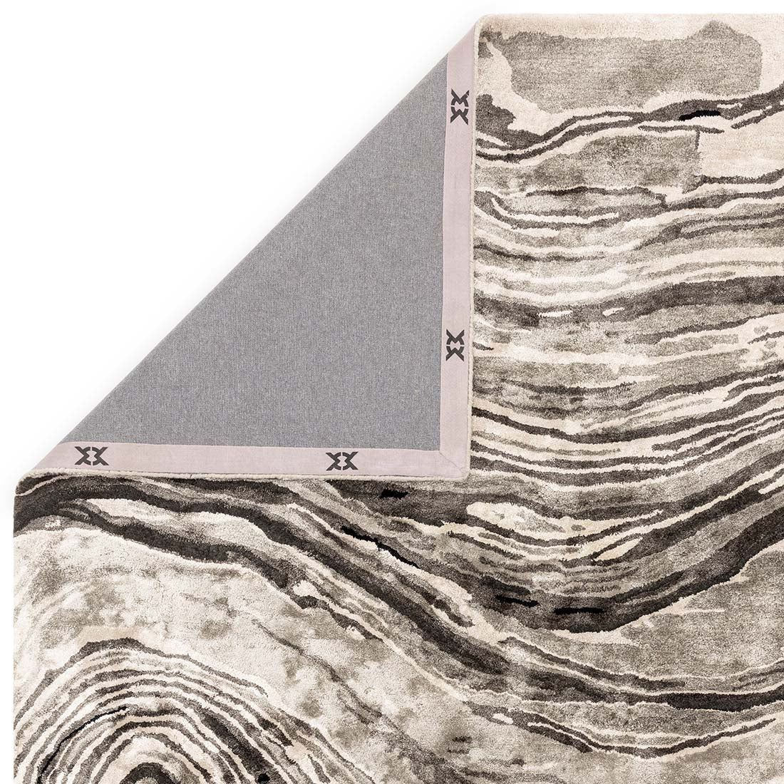 black and beige handtufted abstract rug in a marble design