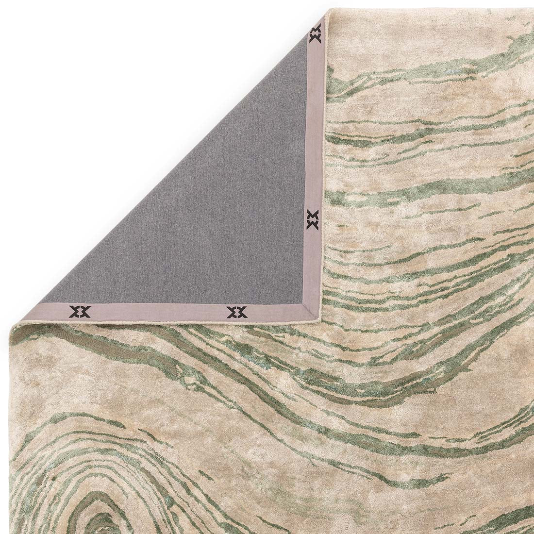 green and beige handtufted abstract rug in a marble design