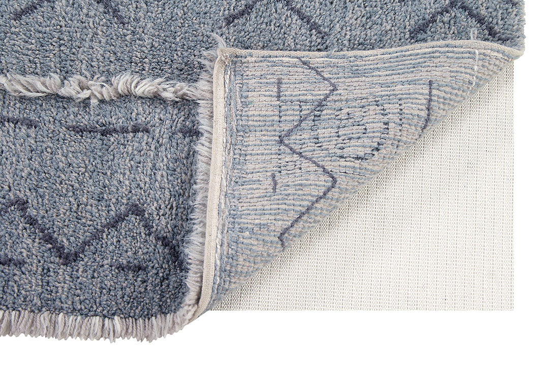 lorena canals washable wool rug with a simple moroccan beni design in blue