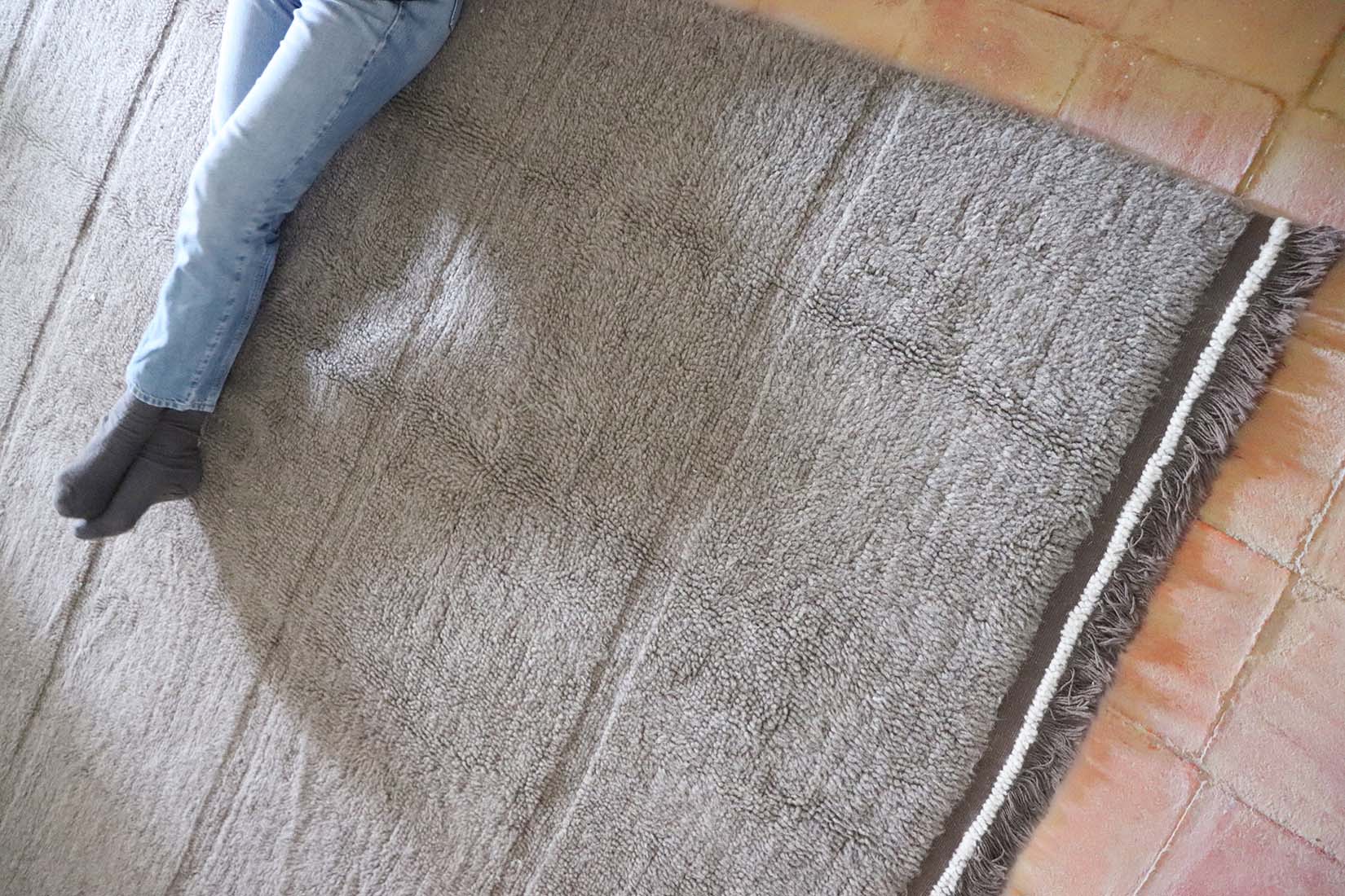 grey washable wool rug with textured detail