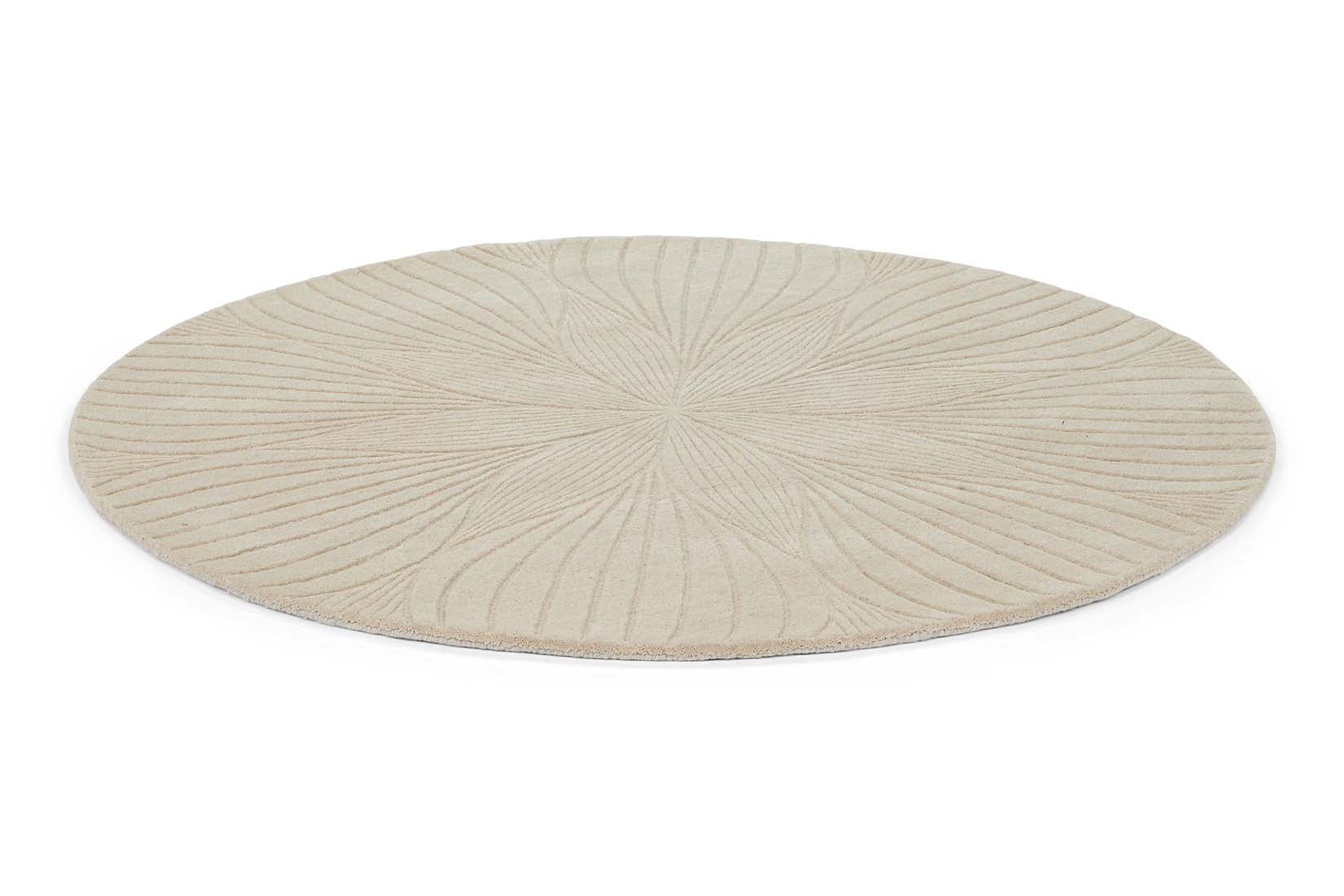 Round beige rug with engraved floral botanical pattern