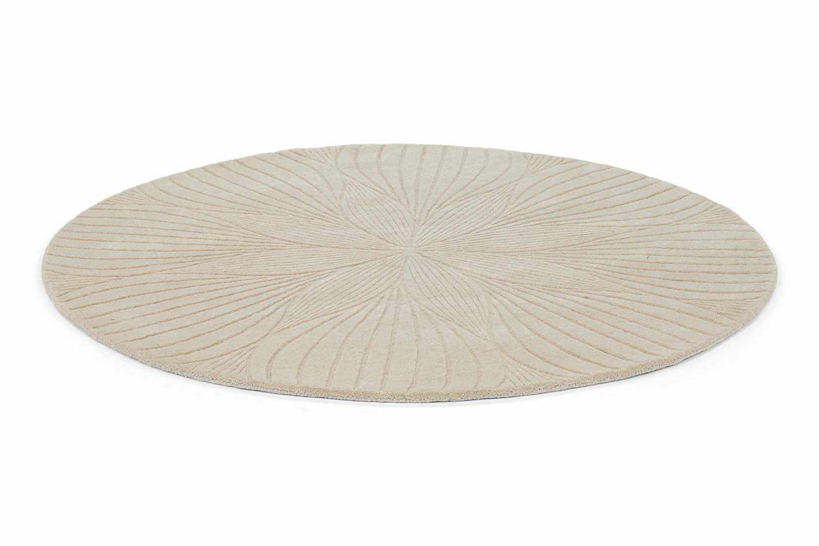 Round beige rug with engraved floral botanical pattern