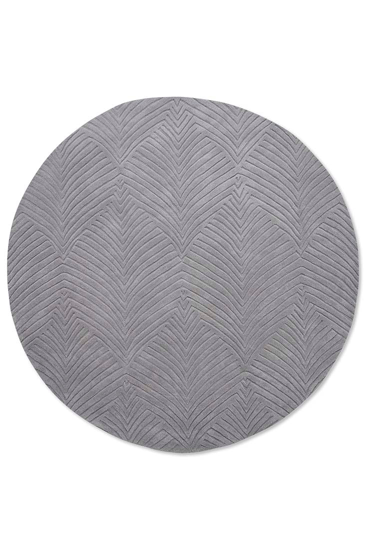 Circular grey rug with engraved leaf pattern