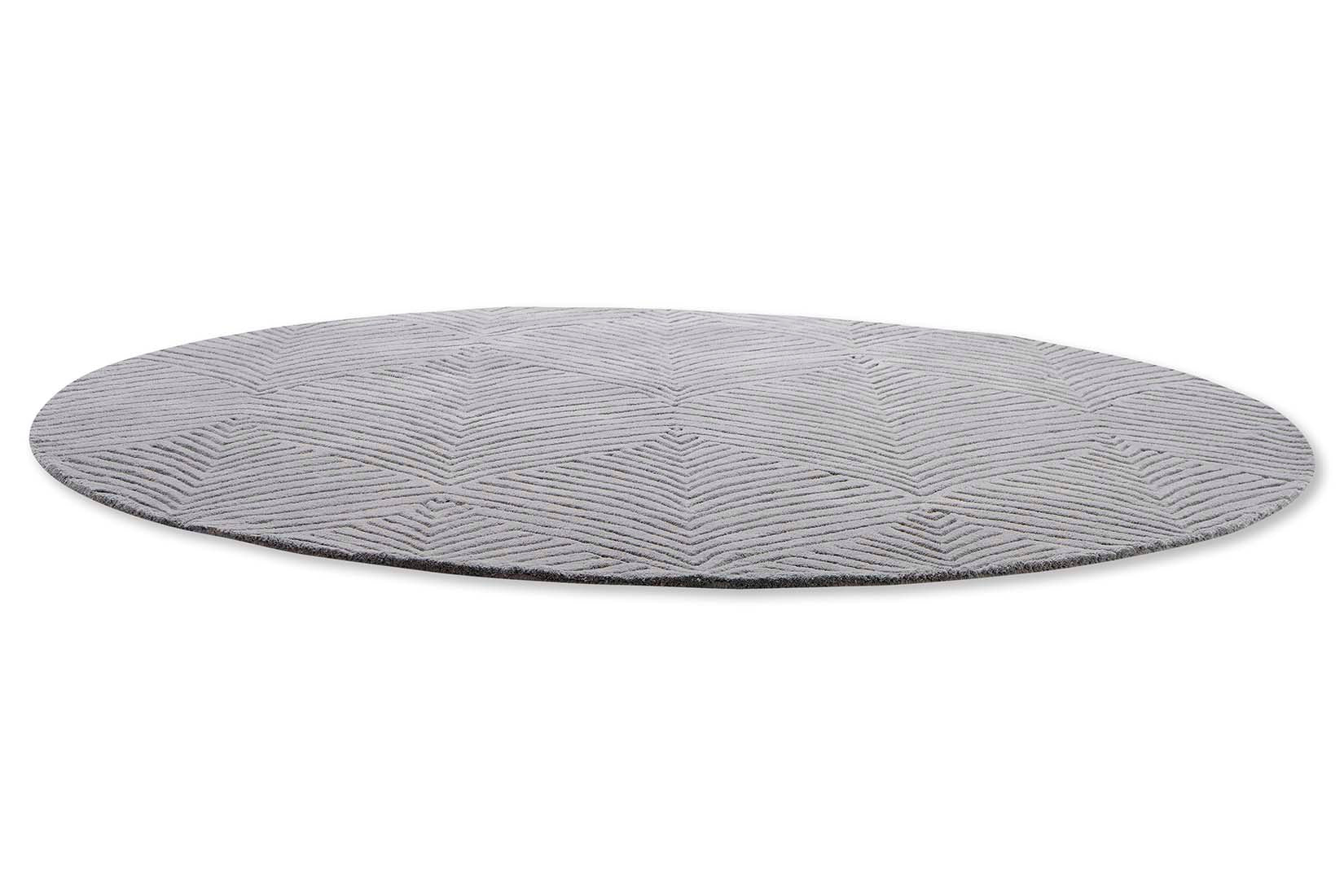 Circular grey rug with engraved leaf pattern