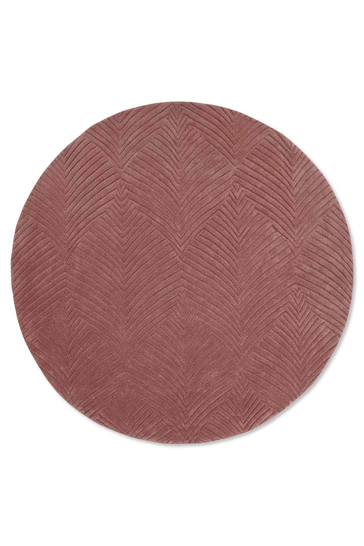 Circular mink rug with engraved leaf pattern