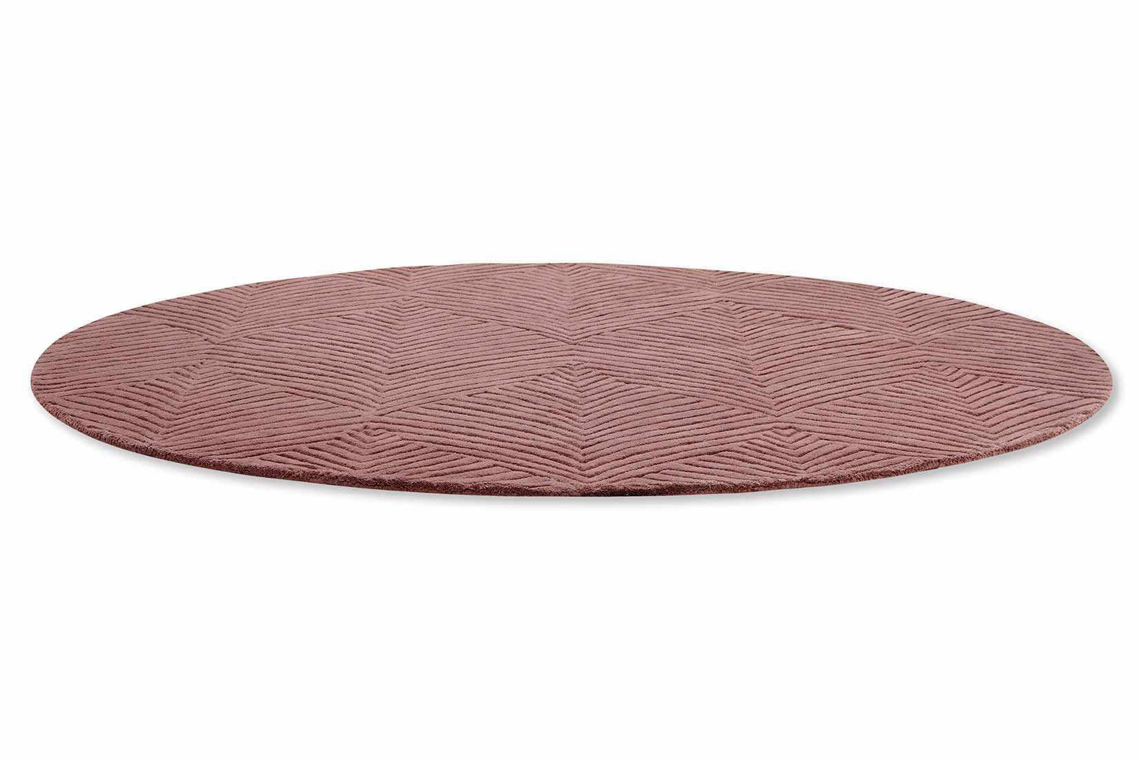Circular mink rug with engraved leaf pattern