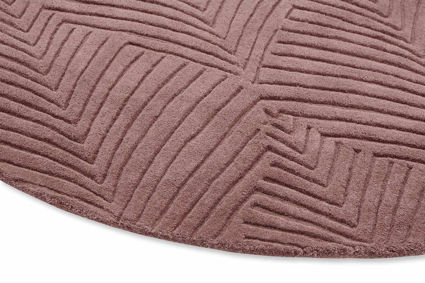 Circular mink rug with engraved leaf pattern