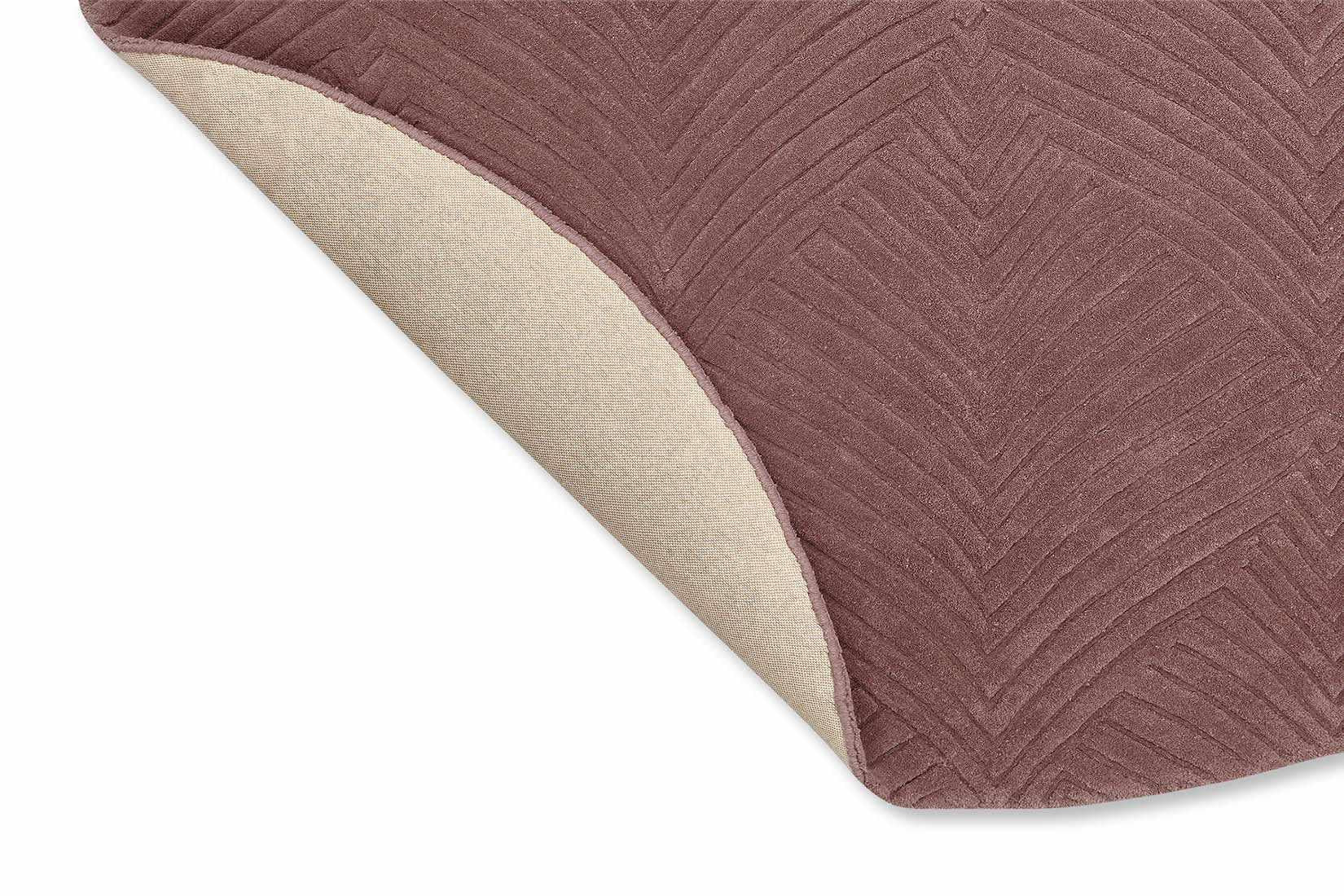 Circular mink rug with engraved leaf pattern