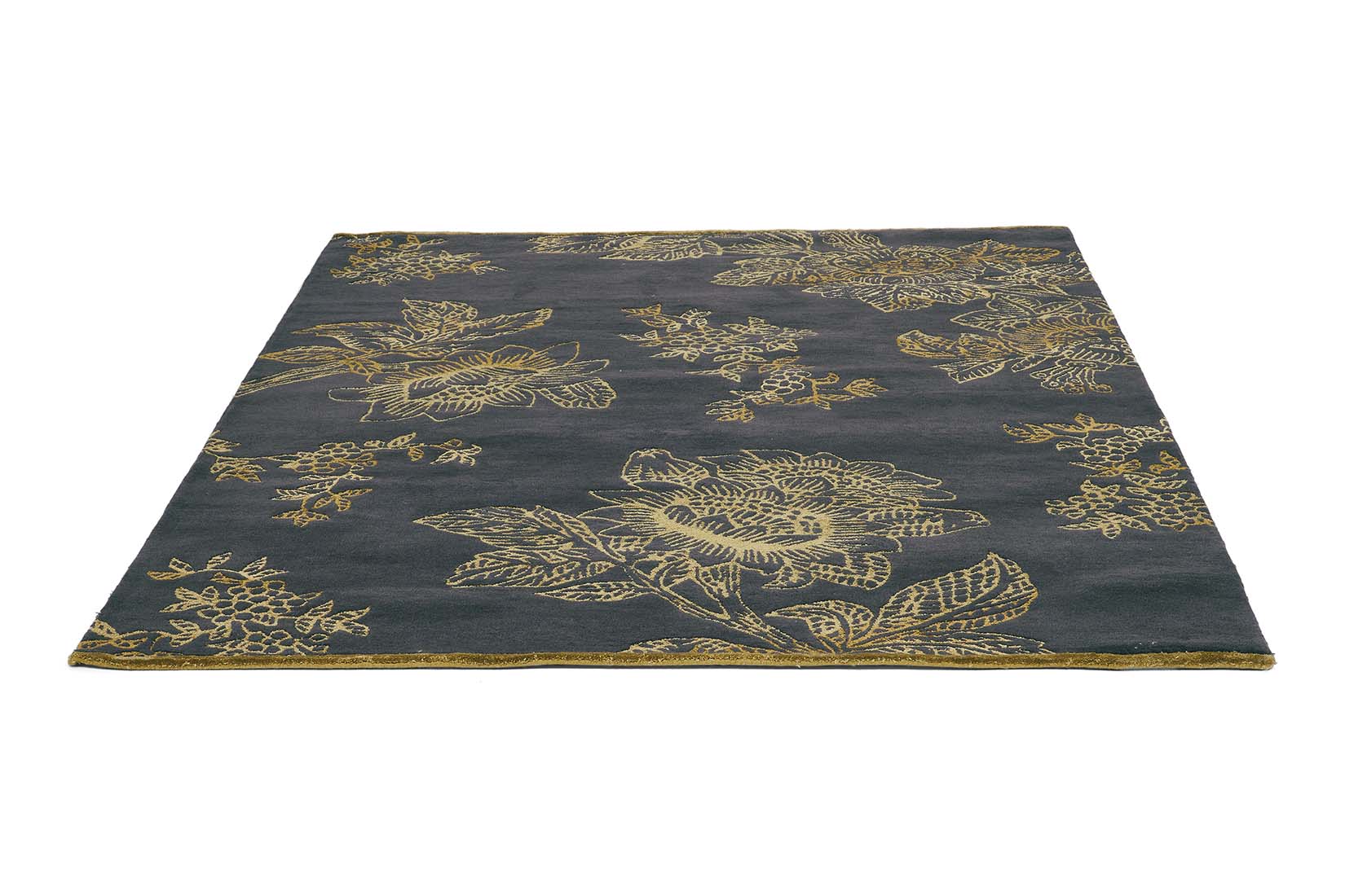 Rectangular black rug with gold floral design