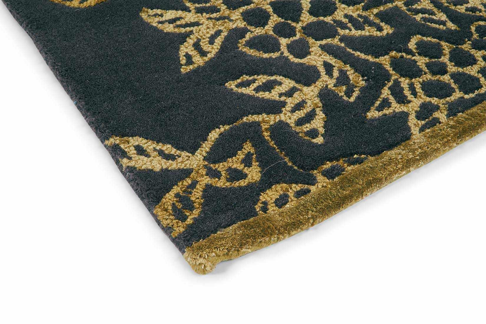 Rectangular black rug with gold floral design