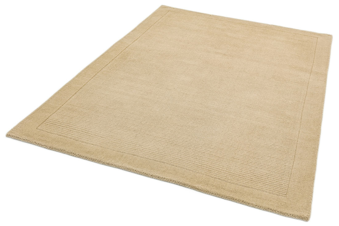 A plain beige rectangle-shaped wool rug with thin border.