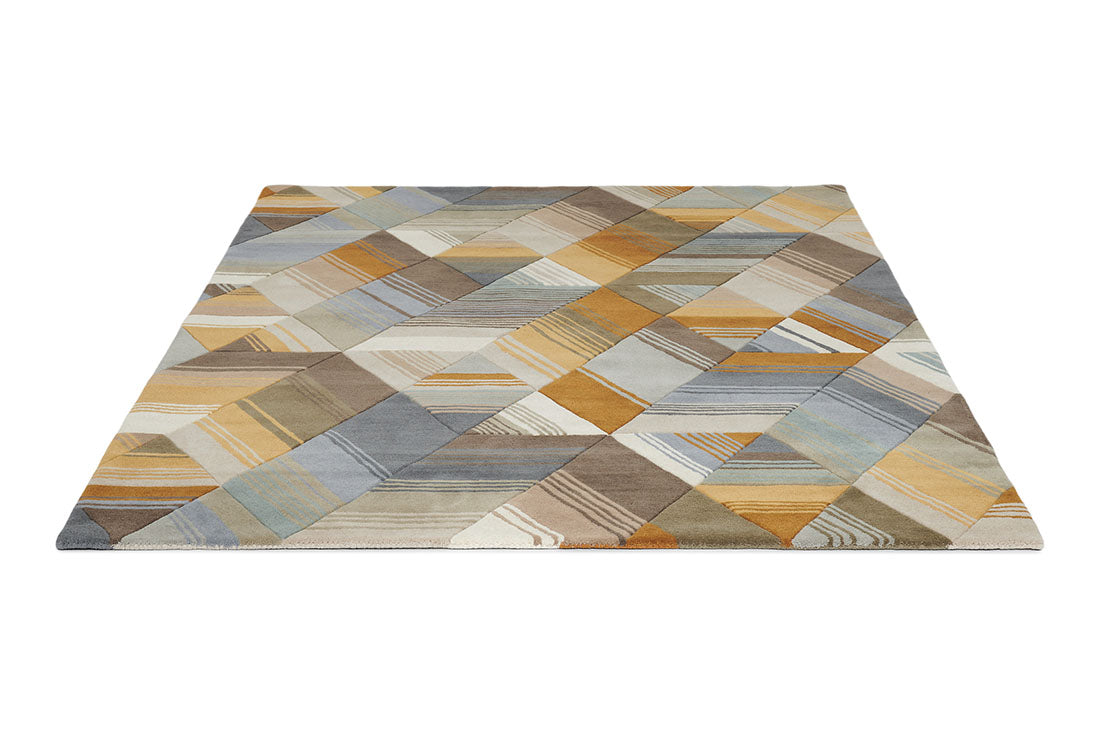 Harlequin rug with a multi-directional stripe design in grey and mustard yellow