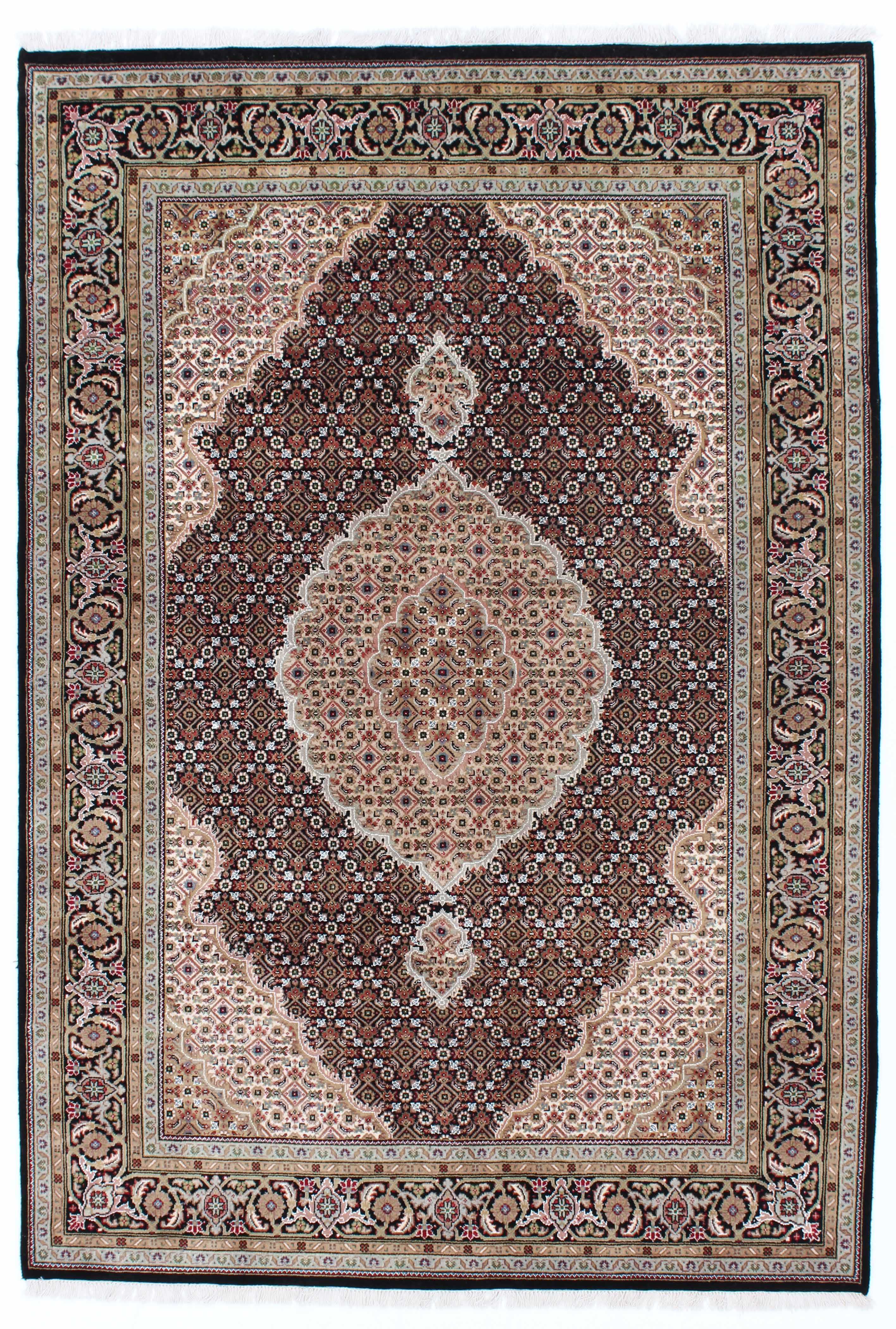 Authentic persian rug with a traditional floral design in cream and red