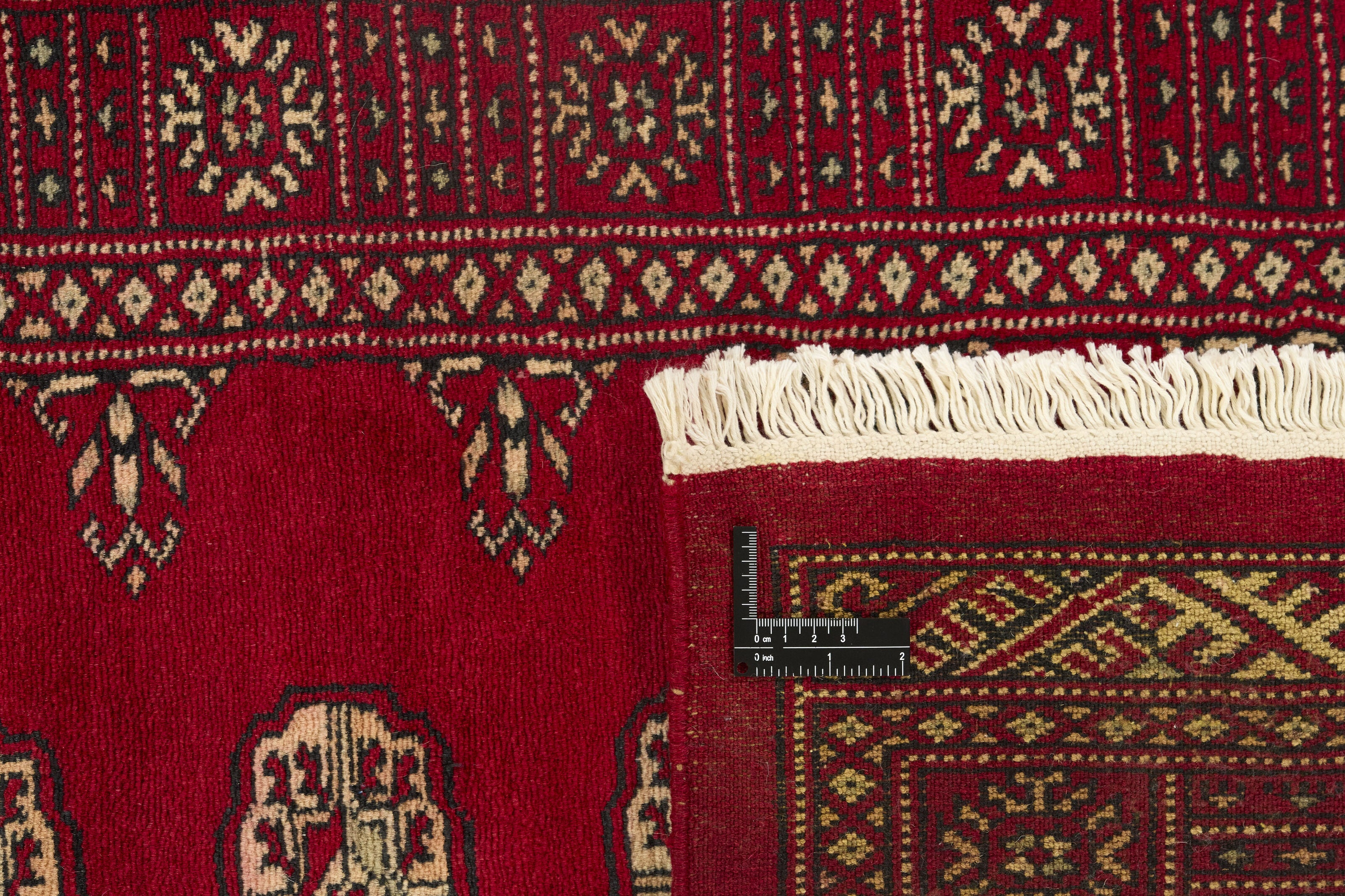 Red Oriental runner with traditional bordered pattern