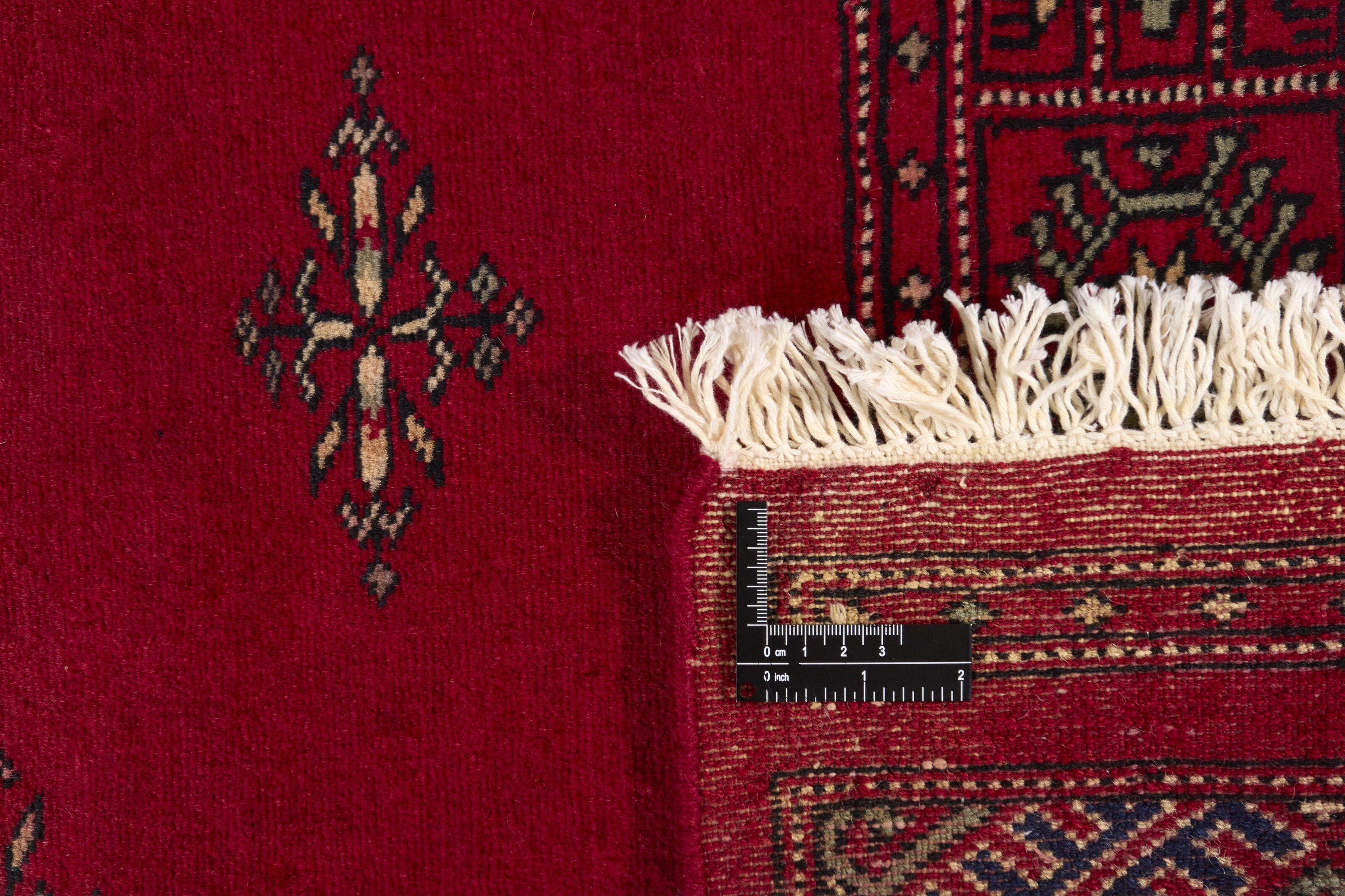 Red Oriental runner with traditional bordered pattern