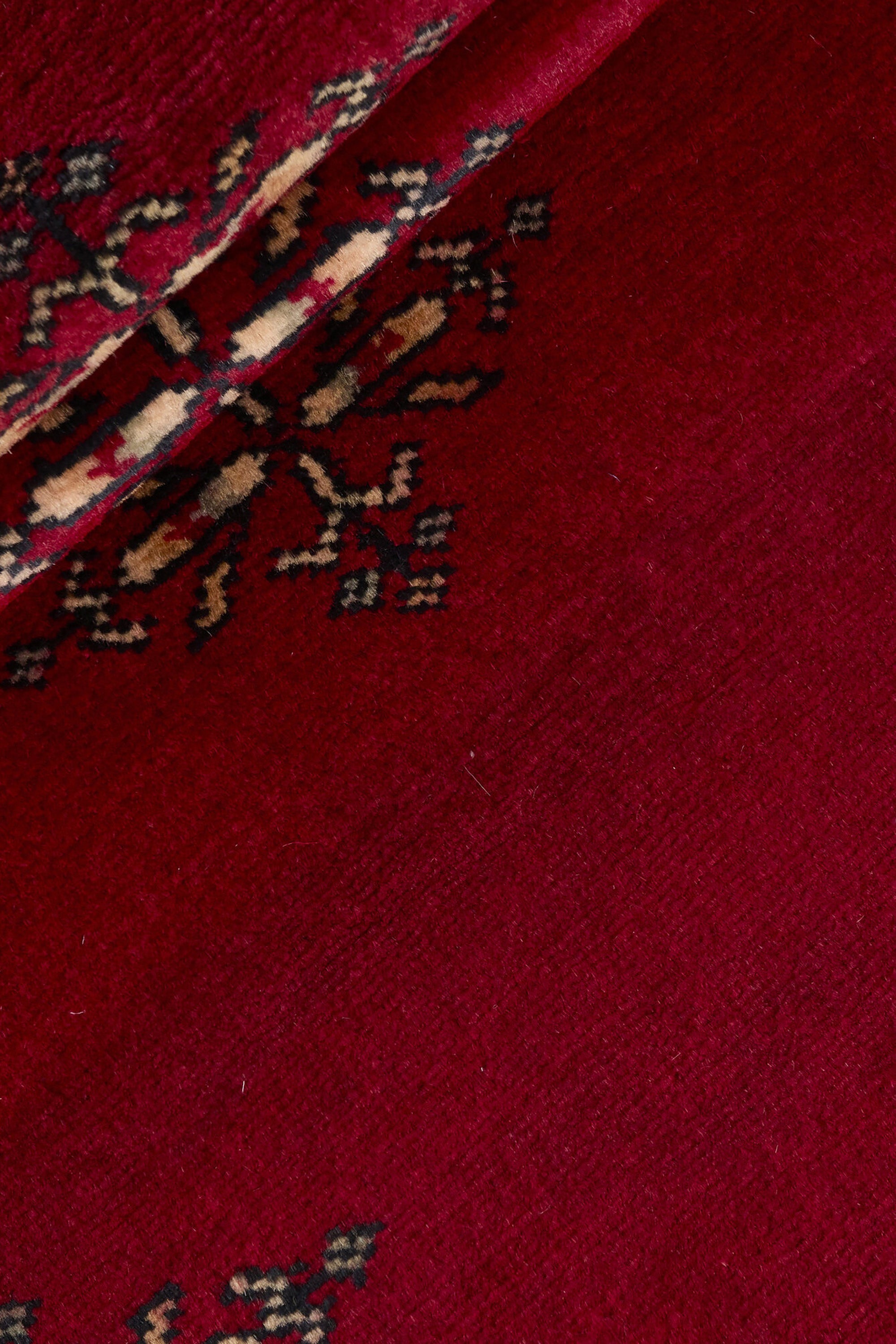 Red Oriental runner with traditional bordered pattern