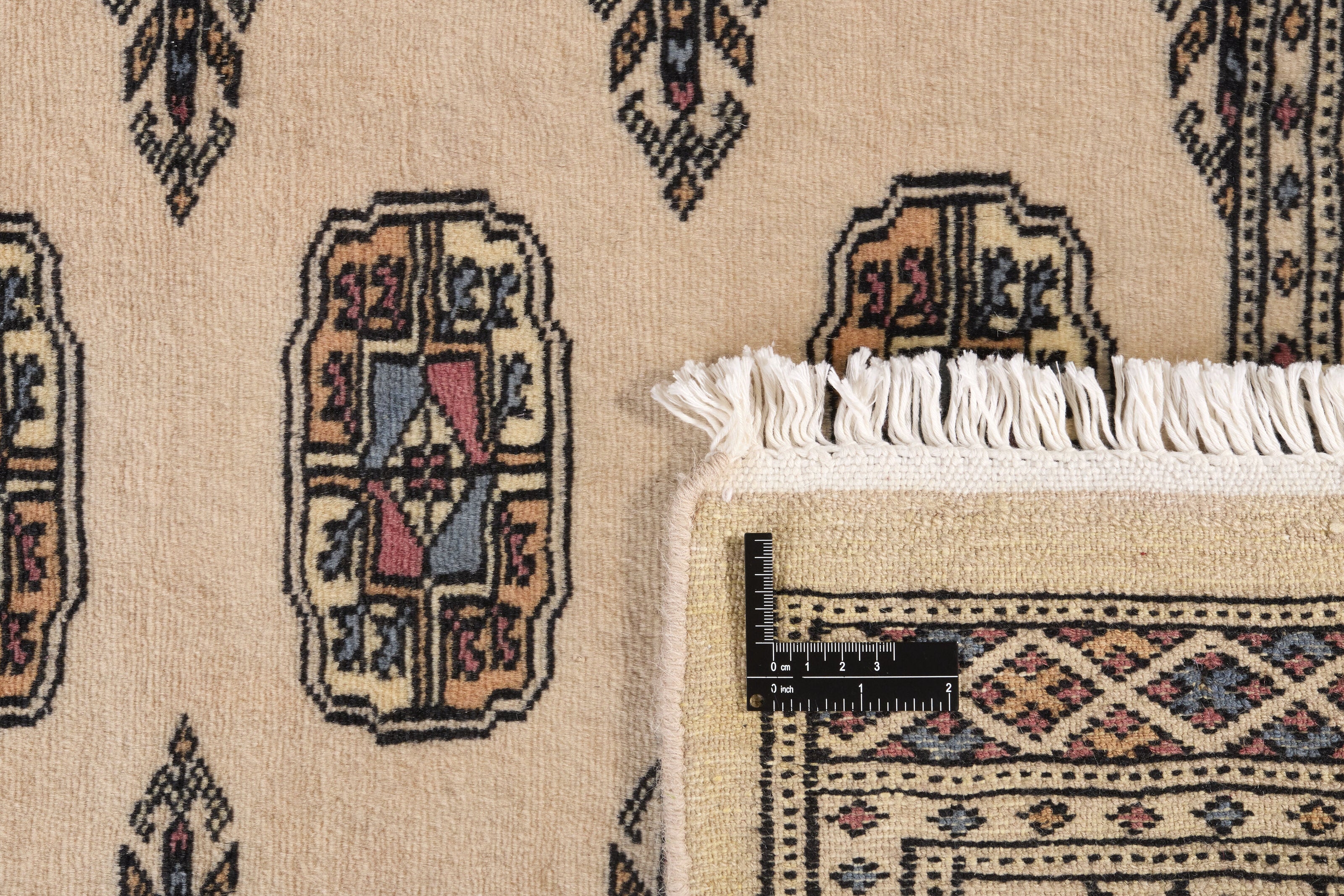 Beige Oriental runner with traditional bordered pattern