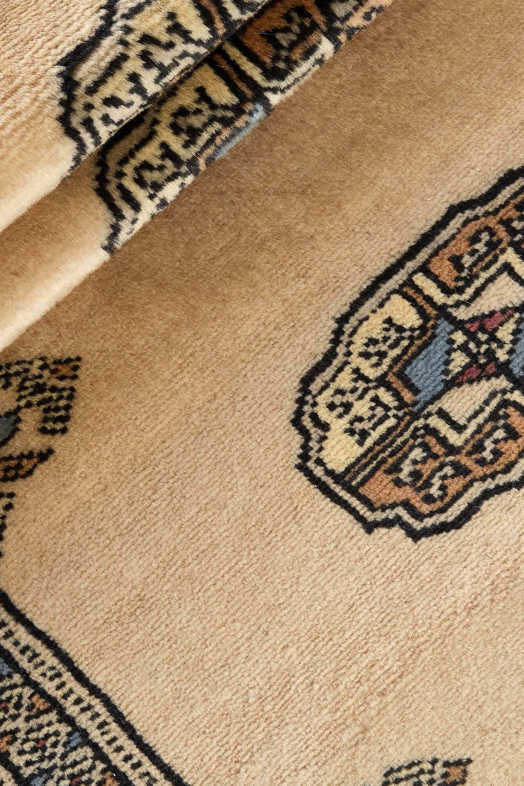 Beige Oriental runner with traditional bordered pattern