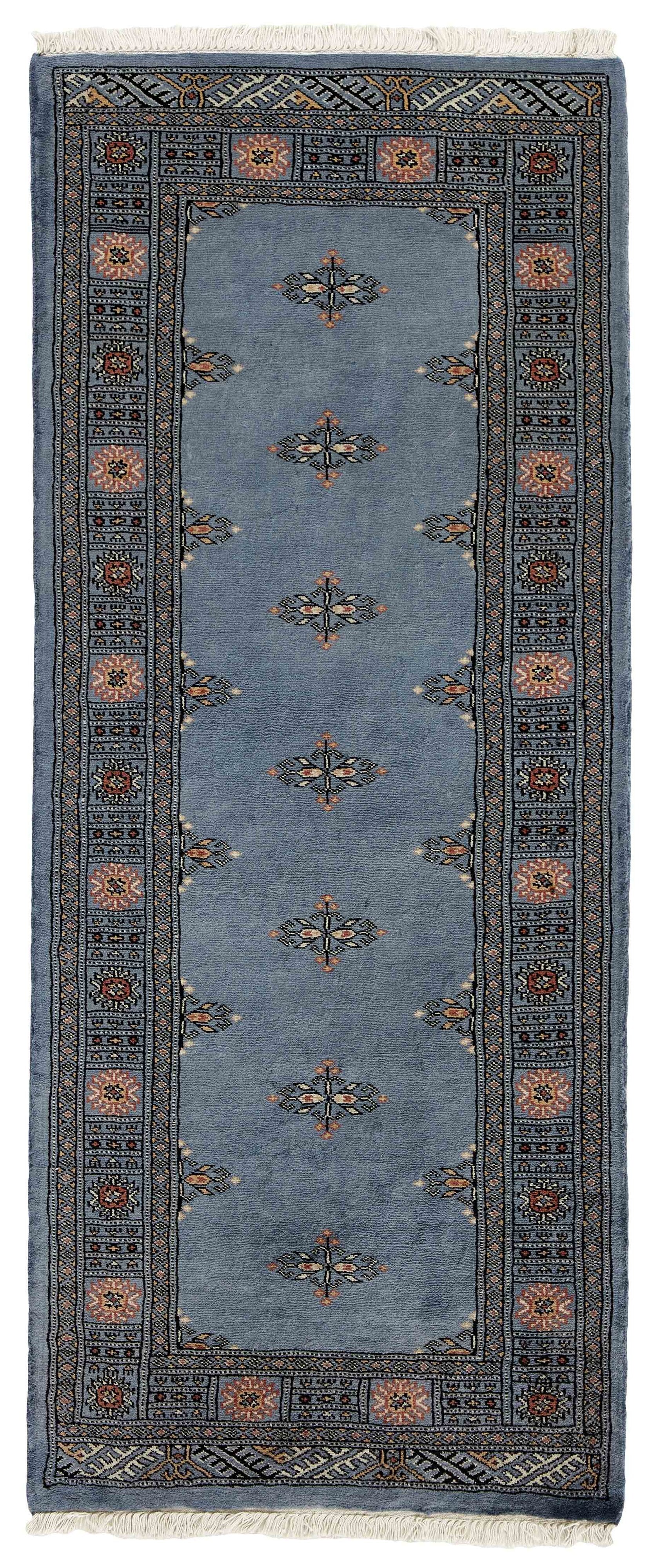 Blue Oriental runner with traditional bordered pattern